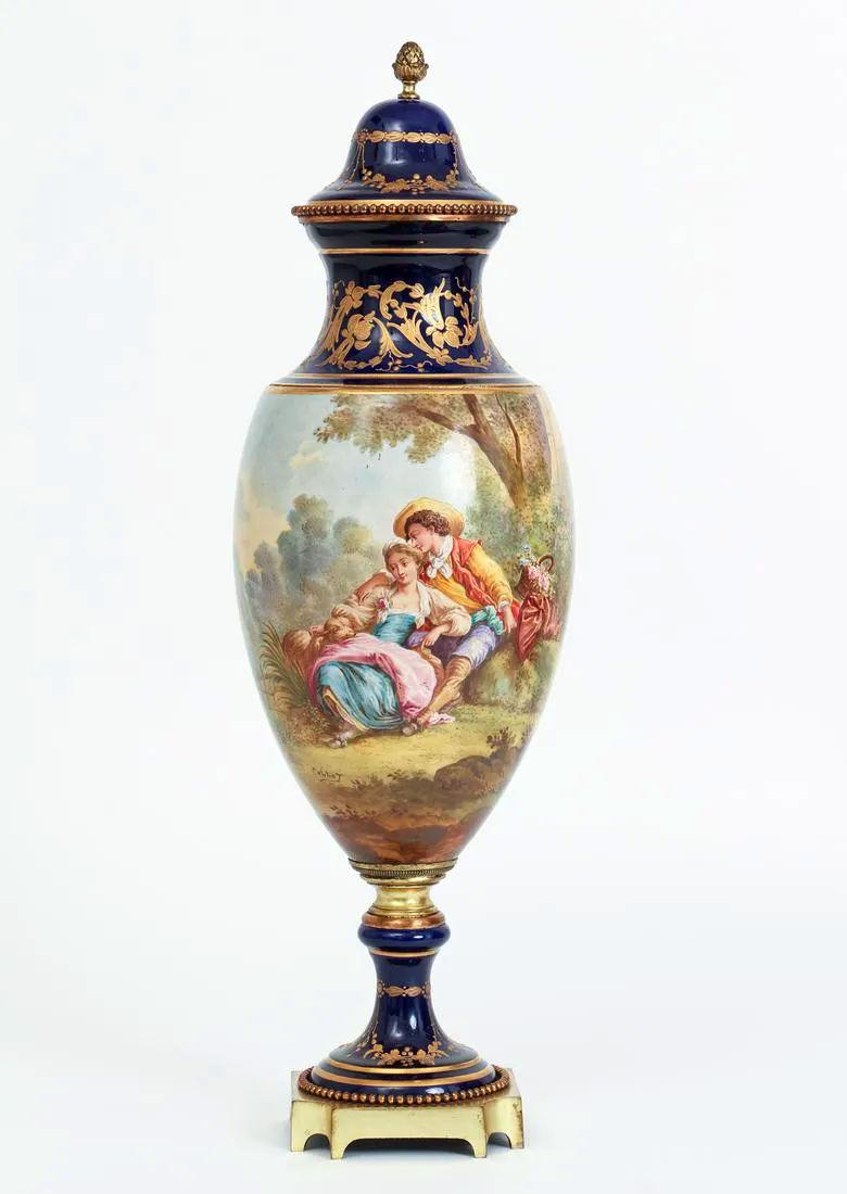 Pair Sevres style porcelain vases with covers decorated by Collot.