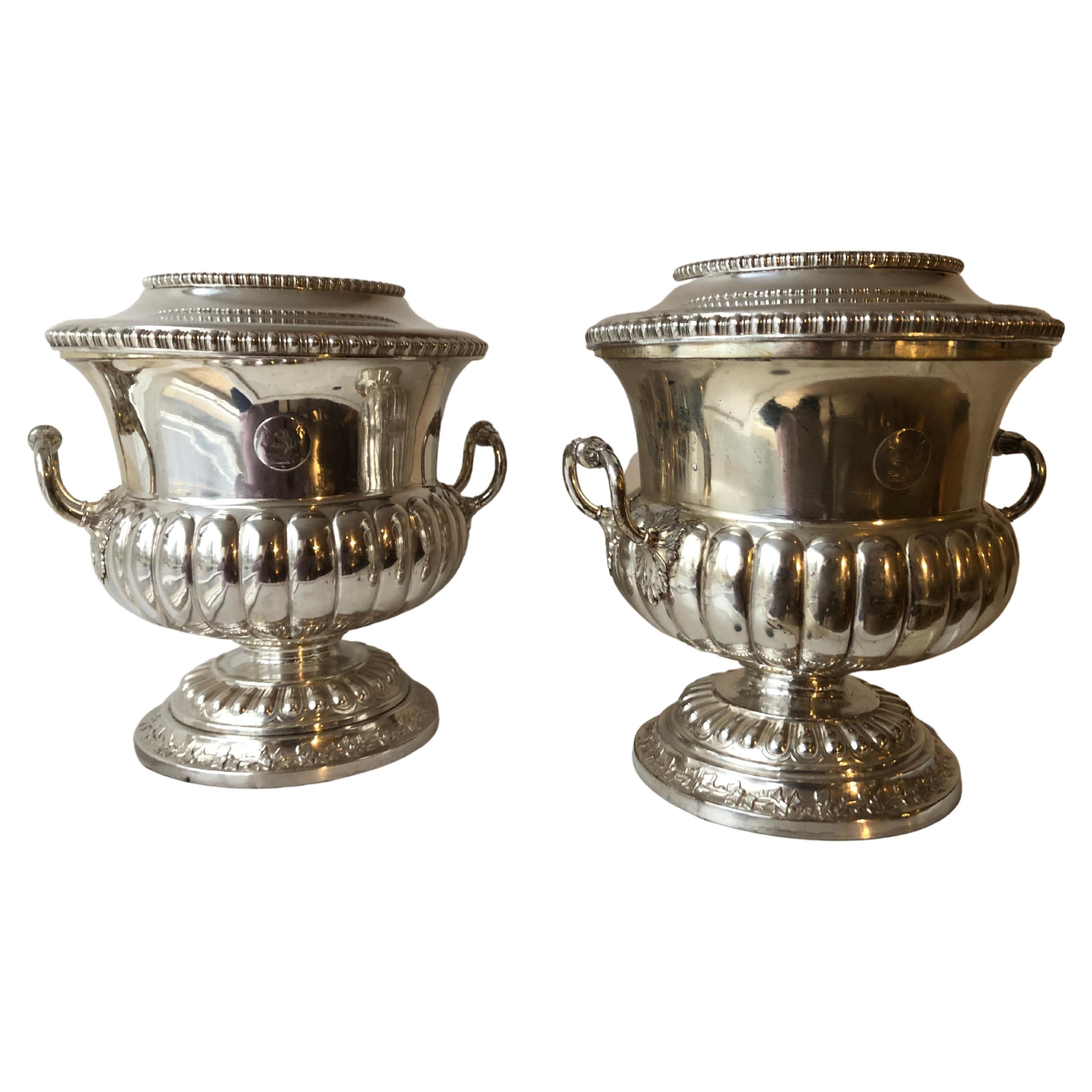 Pair of Sheffield silver plated wine coolers, each cooler consists of three pieces ,rim to top interior bucket and the main housing for ice around the liner for cooling, double handles elegant Regency design.