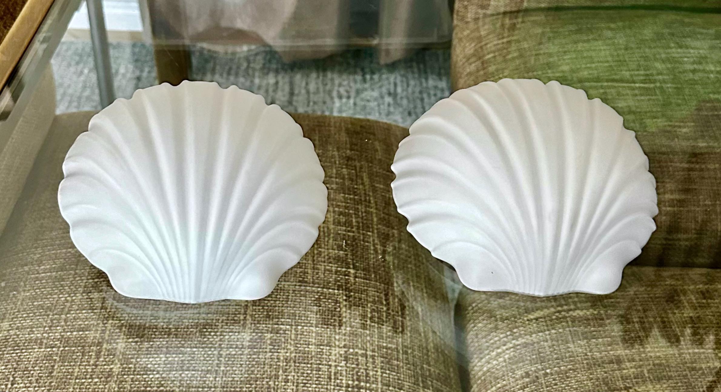 Pair of opaline glass clam shell shaped wall sconces by Limburg, Germany.  Each takes one candelabra size bulb.
    