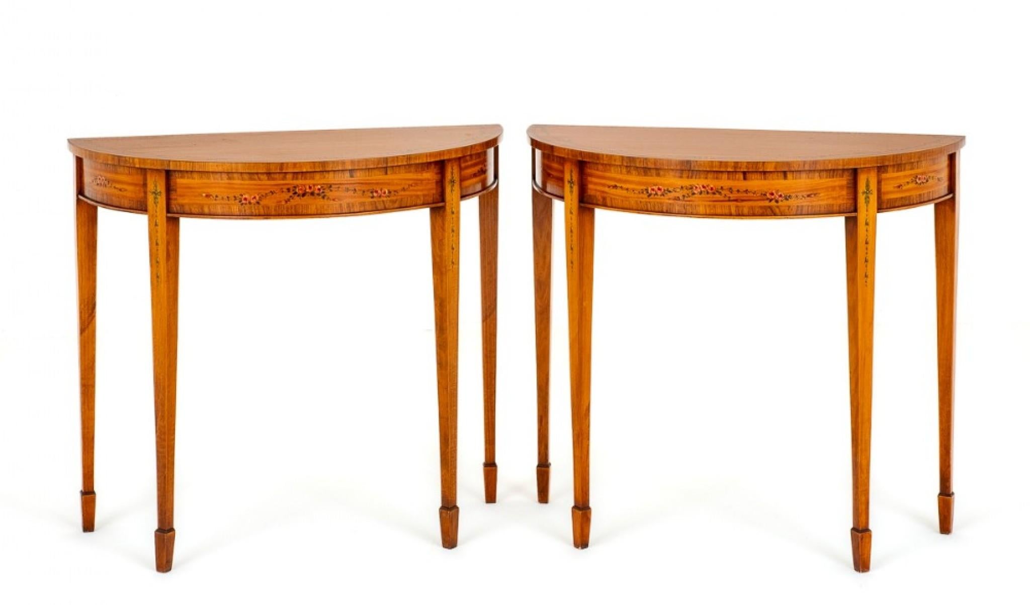 Pair of Satinwood Sheraton Revival Console Tables.
These Rather Elegant Console Tables are Raised upon Tapered Legs with Spade Feet.
Circa 1920
The Frieze and Tops of the Tables Featuring Rosewood Cross bandings.
The Whole of the Tables Having