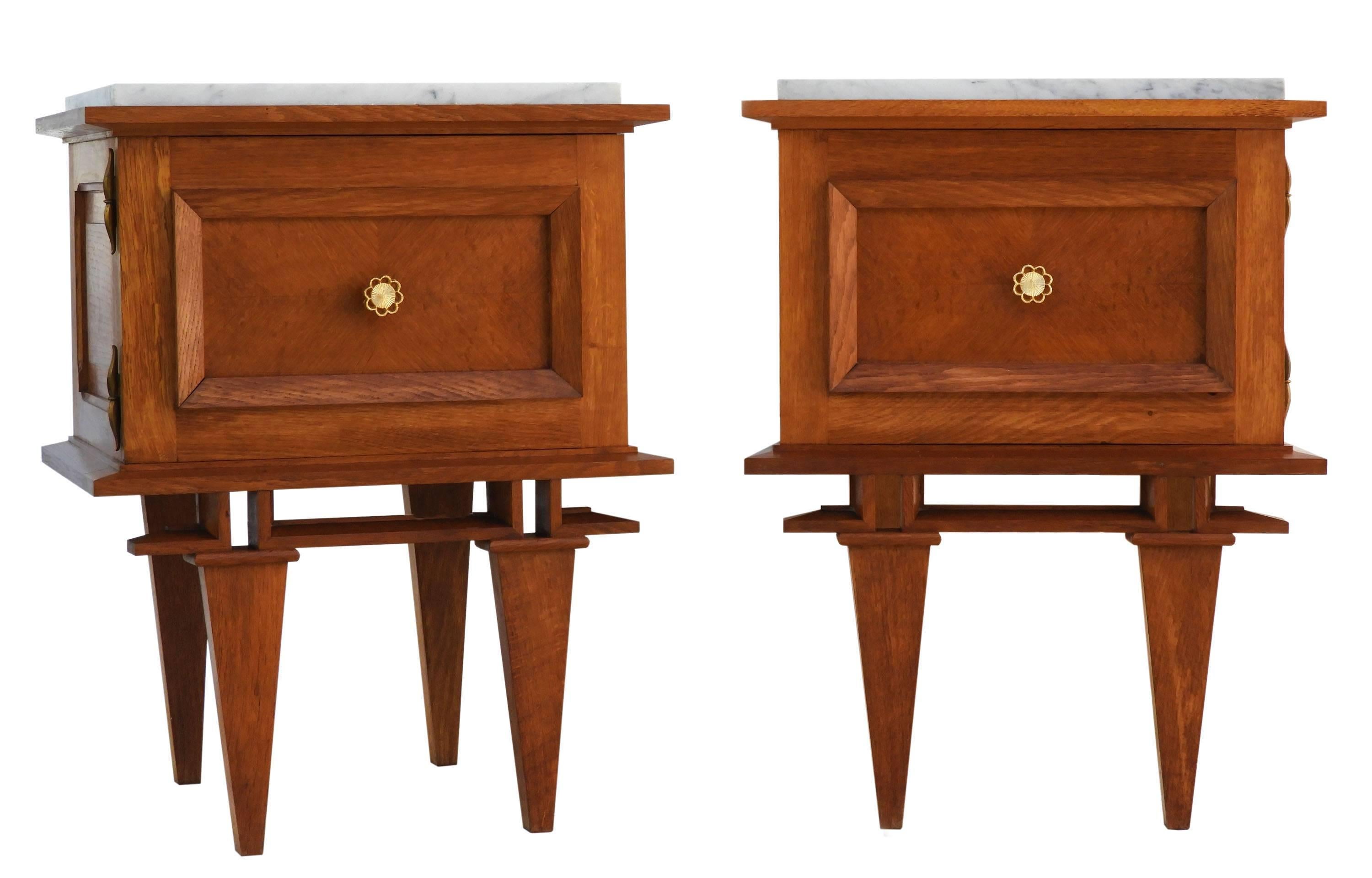 Pair of side cabinets midcentury nightstands bedside tables French, circa 1950
Solid oak cabinets with decorative gilt metal handles and marble tops
Very good condition for their age with only very minor marks of use.
There is also a matching bed