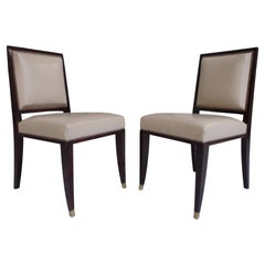 Pair side chairs from the Hotel Baur-au-Lac Zürich leather & brass on front legs