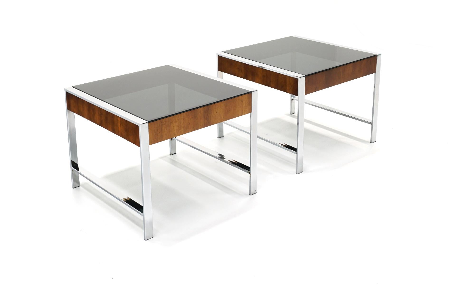 Pair of chrome and walnut end tables with smoked gray / grey glass tops. Only very light scratches to the table tops, no pitting to the chrome and a few very small blemishes to the walnut. Priced to sell.