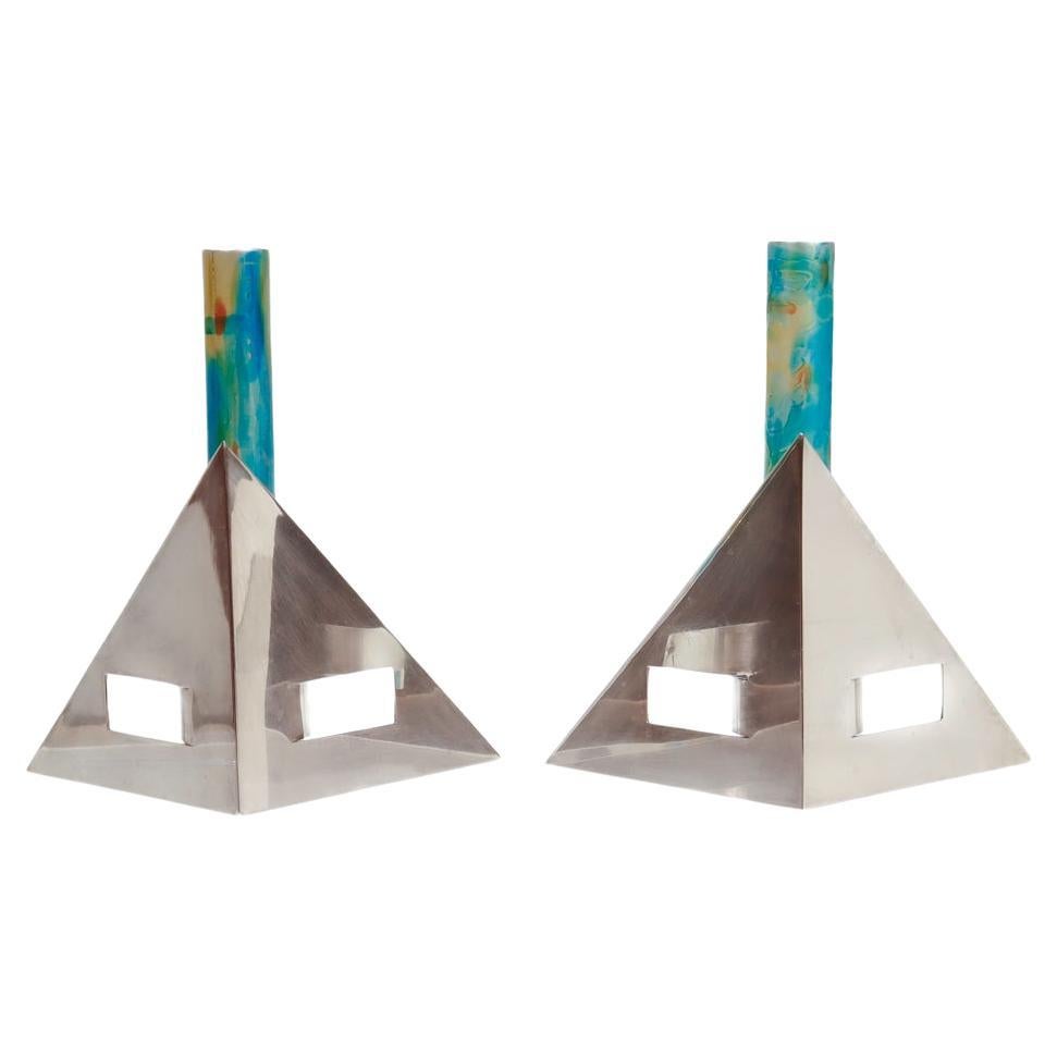 A fine pair of signed Modernist silver candlesticks.

By Arie Ofir.

In sterling silver with anodized aluminum central candle holders.

Bearing a dedication to one: 