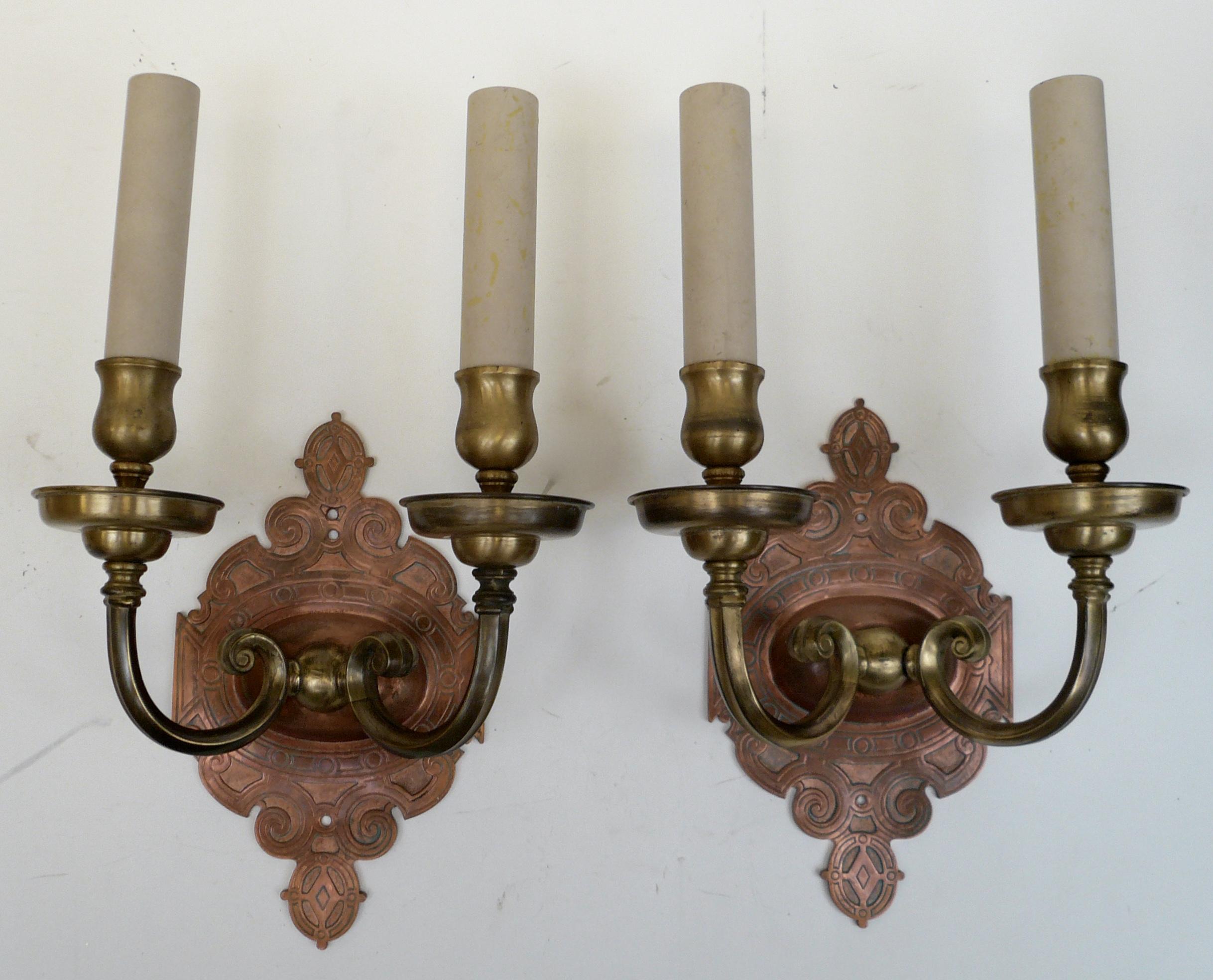 This handsome pair of signed E. F. Caldwell sconces are of mixed metal, and in the Arts & Crafts style.