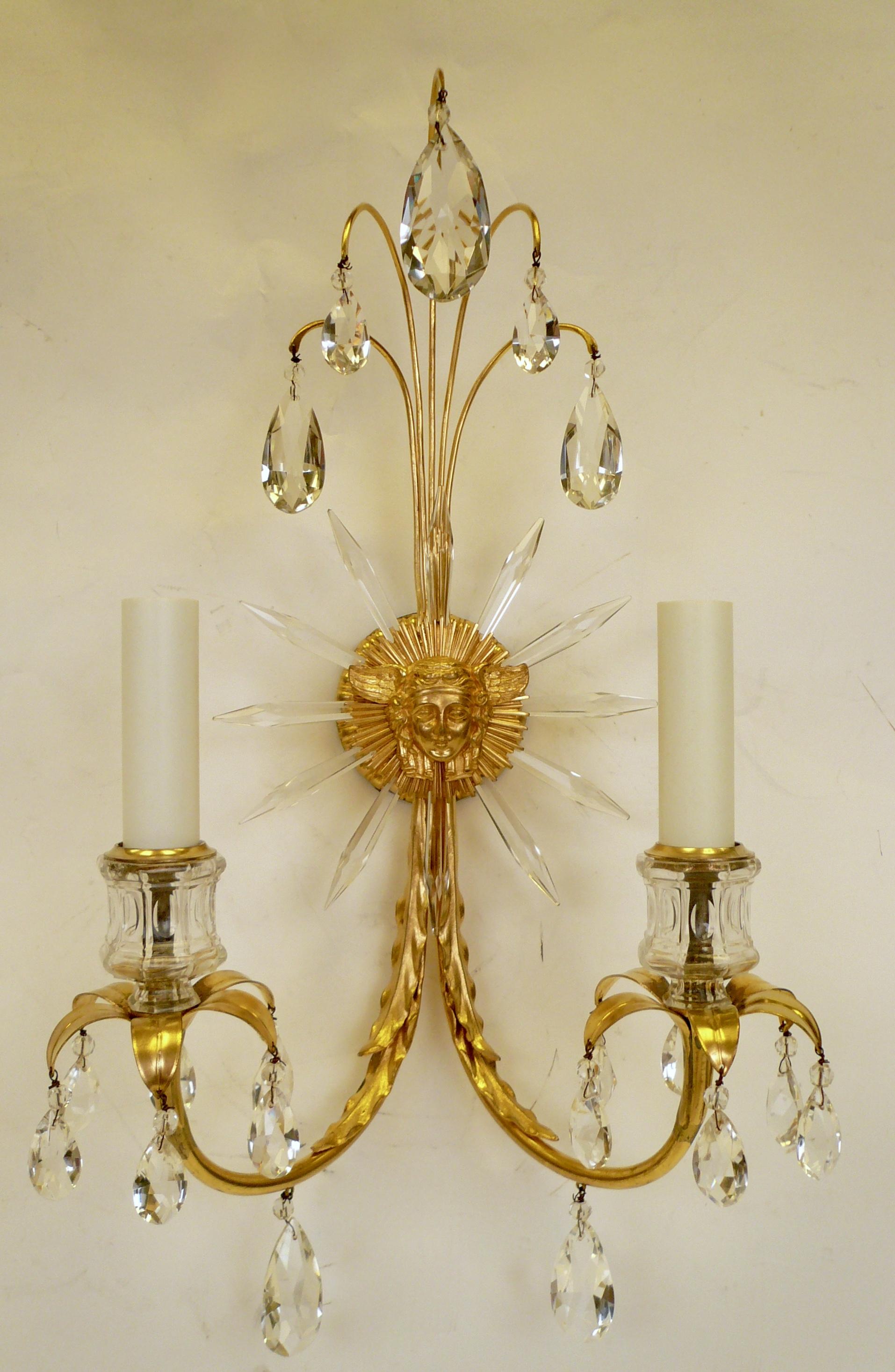 This beautifully detailed pair of Caldwell sconces feature Classical motifs including the winged head of the God Mercury, and acanthus leaves. They retain their original finish and crystal prisms.