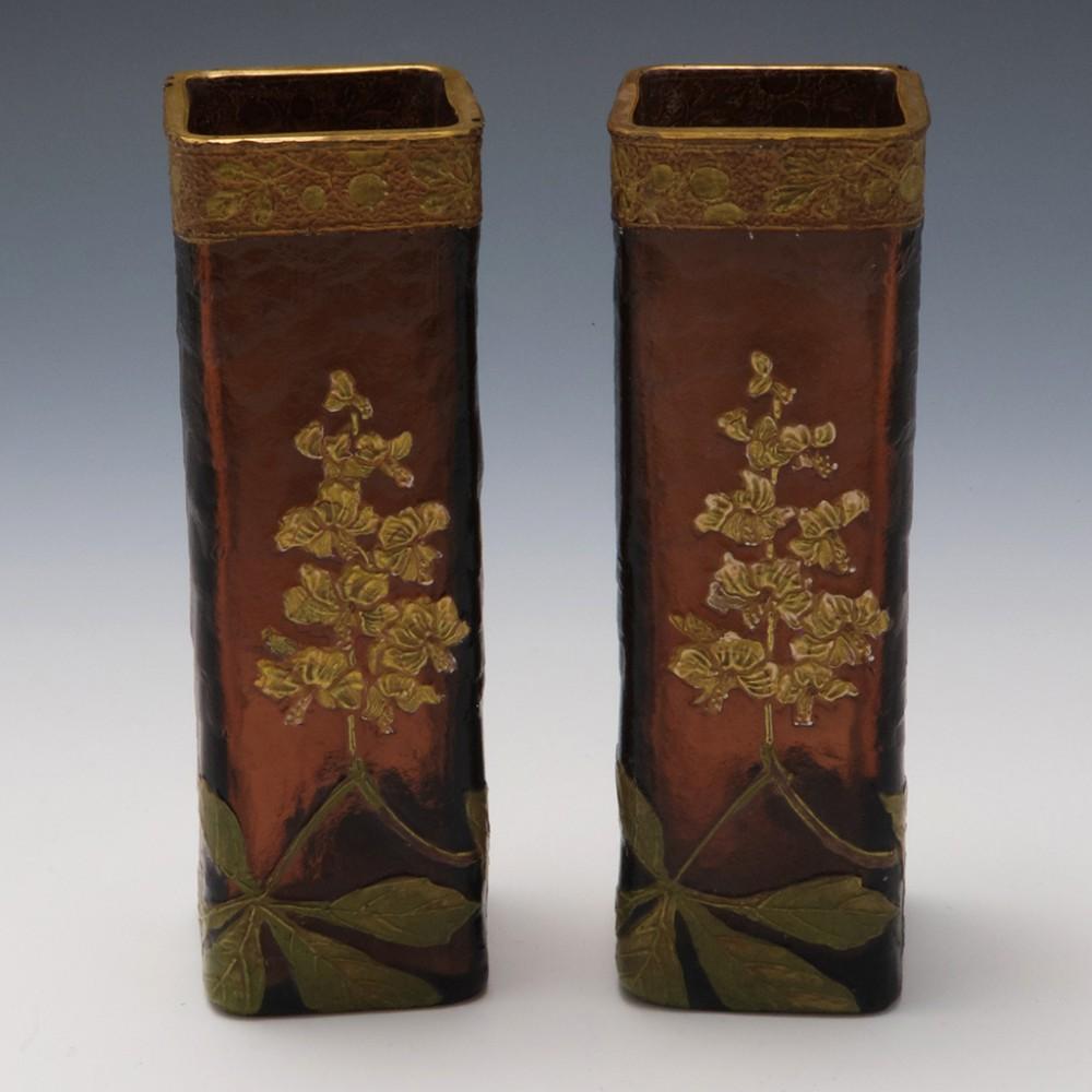 Heading : A pair of signed Mont Joye Legras vases depicting horse chestnut
Date : c1900
Origin : Paris, France
Colour : Golden brown ground, white,gold and green enamels
Bowl : Square cross-section. High relief gilded collar, acid etched surface