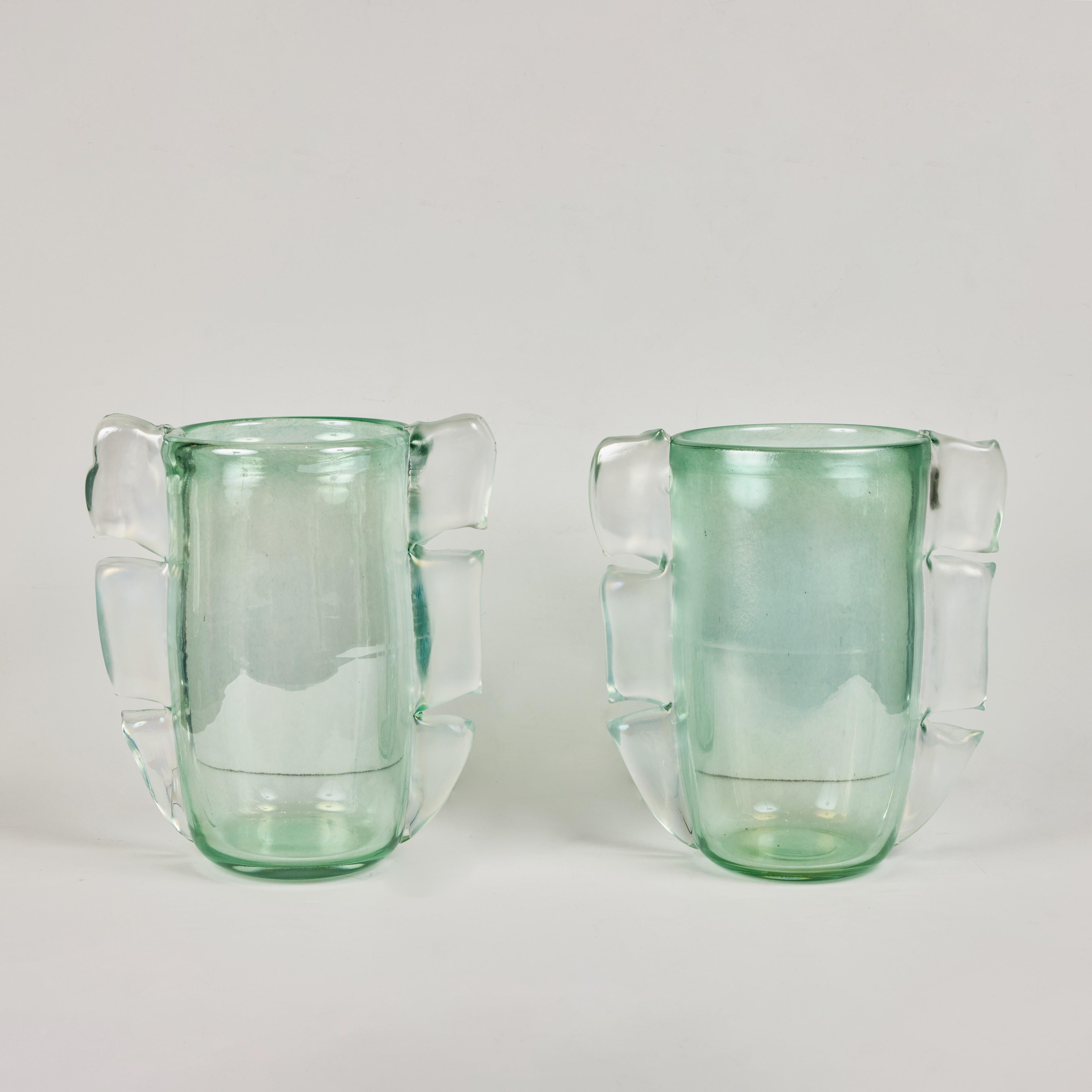 A pair of mid-century, signed,  Murano light green glass vases with opaque glass embellishment.  