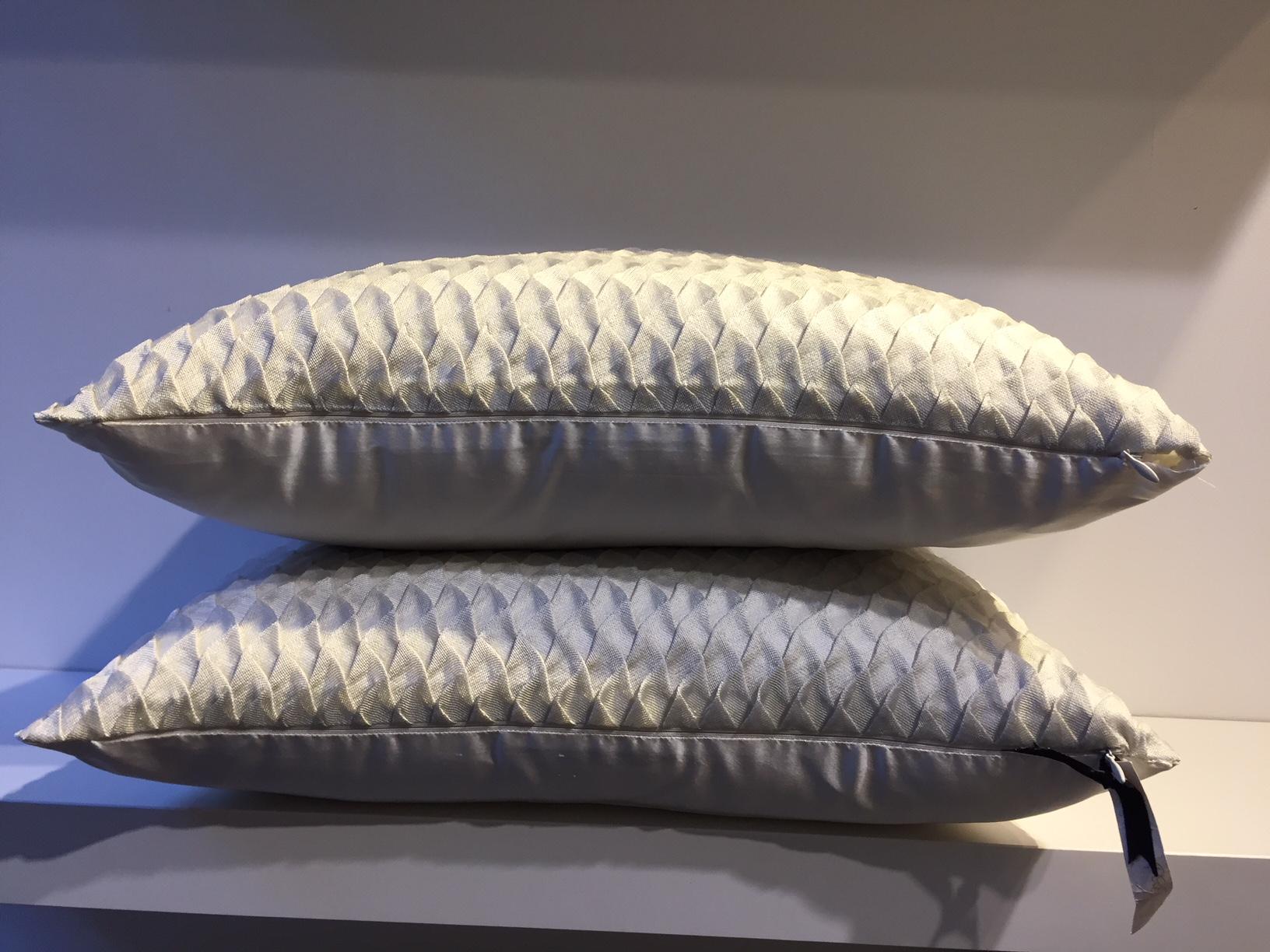 One pair silk cushions with embossed front panel in steam pleated silk mesh, fish scale pattern, back panel plain silk, handwoven silk taffeta col. Oyster, size 35 x 50cm,
cushion cover with cotton lining, concealed zipper in the bottom
