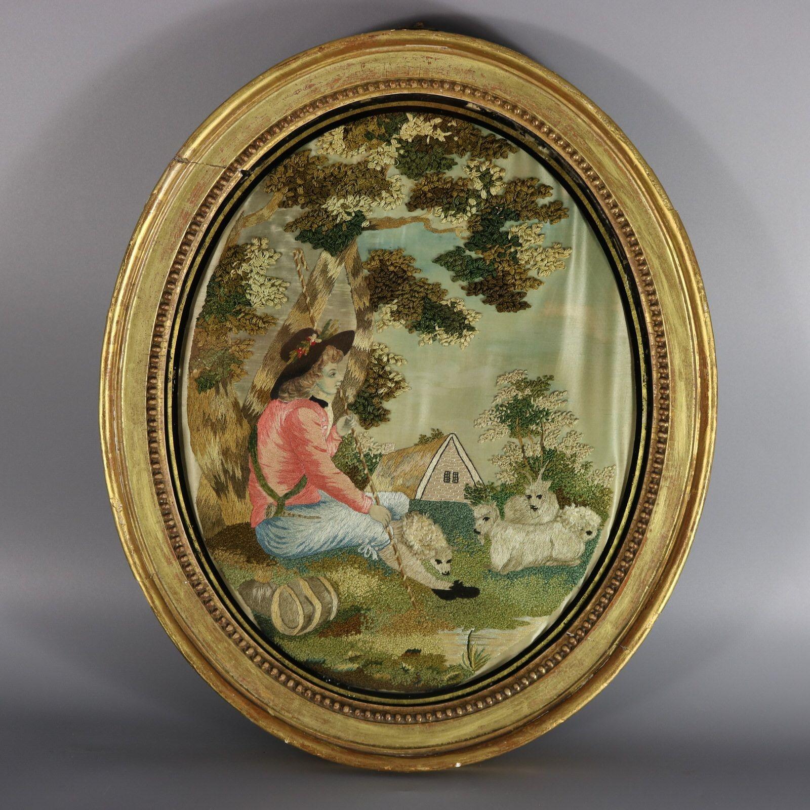 Pair of oval Antique Georgian Silkwork Embroidered pictures depicting a shepherd and shepherdess in a country scene. The embroidery is worked in silk on a silk ground, with painted details on the ground. Colours browns, cream, green, pink, blues and