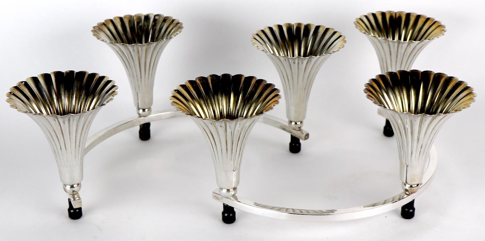 Pair of decorative candlesticks by Sheffield Silver Company. Each semi circular candlestick has three trumpet form candleholders, each candleholder 3.5 inch dia. at top. Clean, original and ready to use.