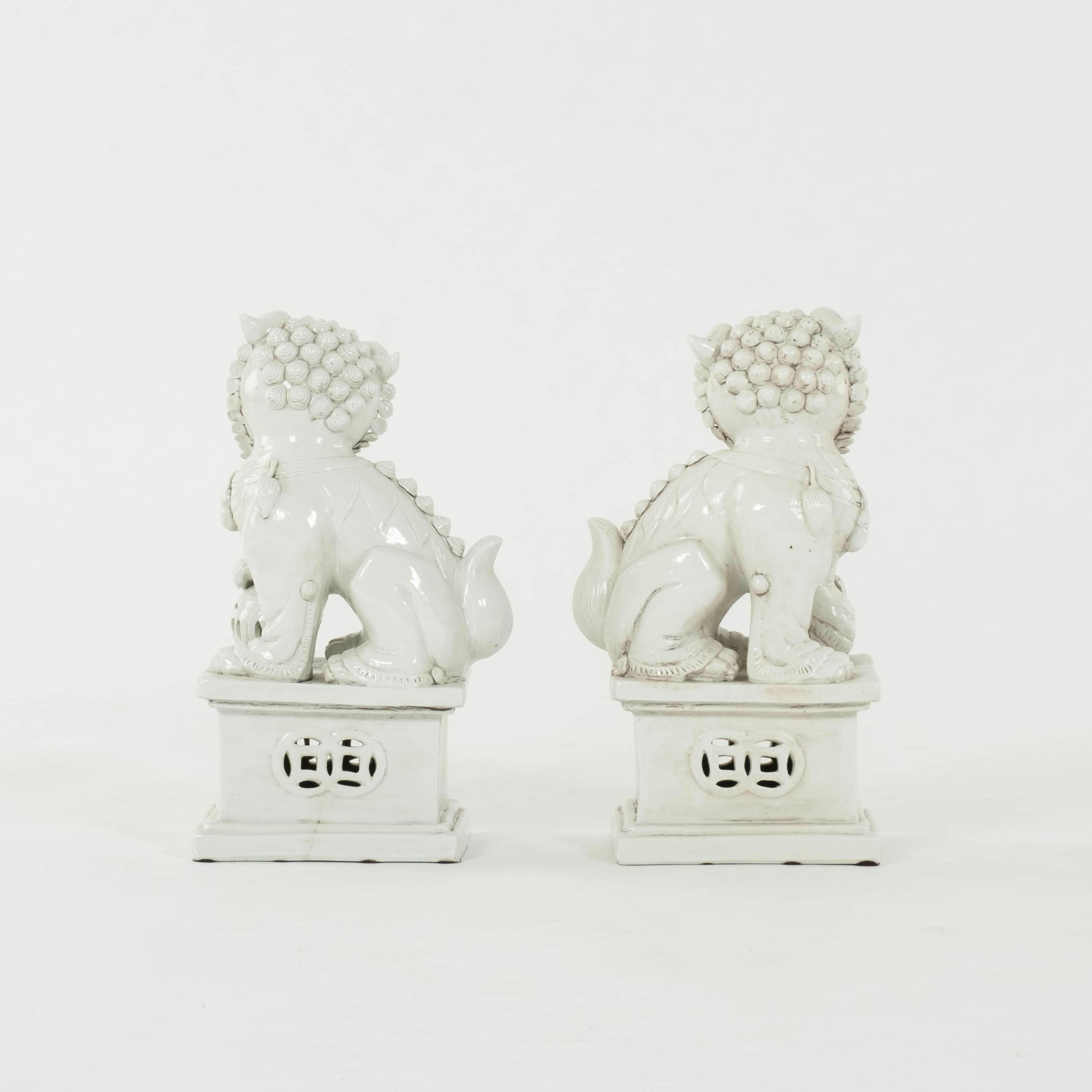 Chinese Export Pair Sitting Blanc de Chine Fu Dogs For Sale