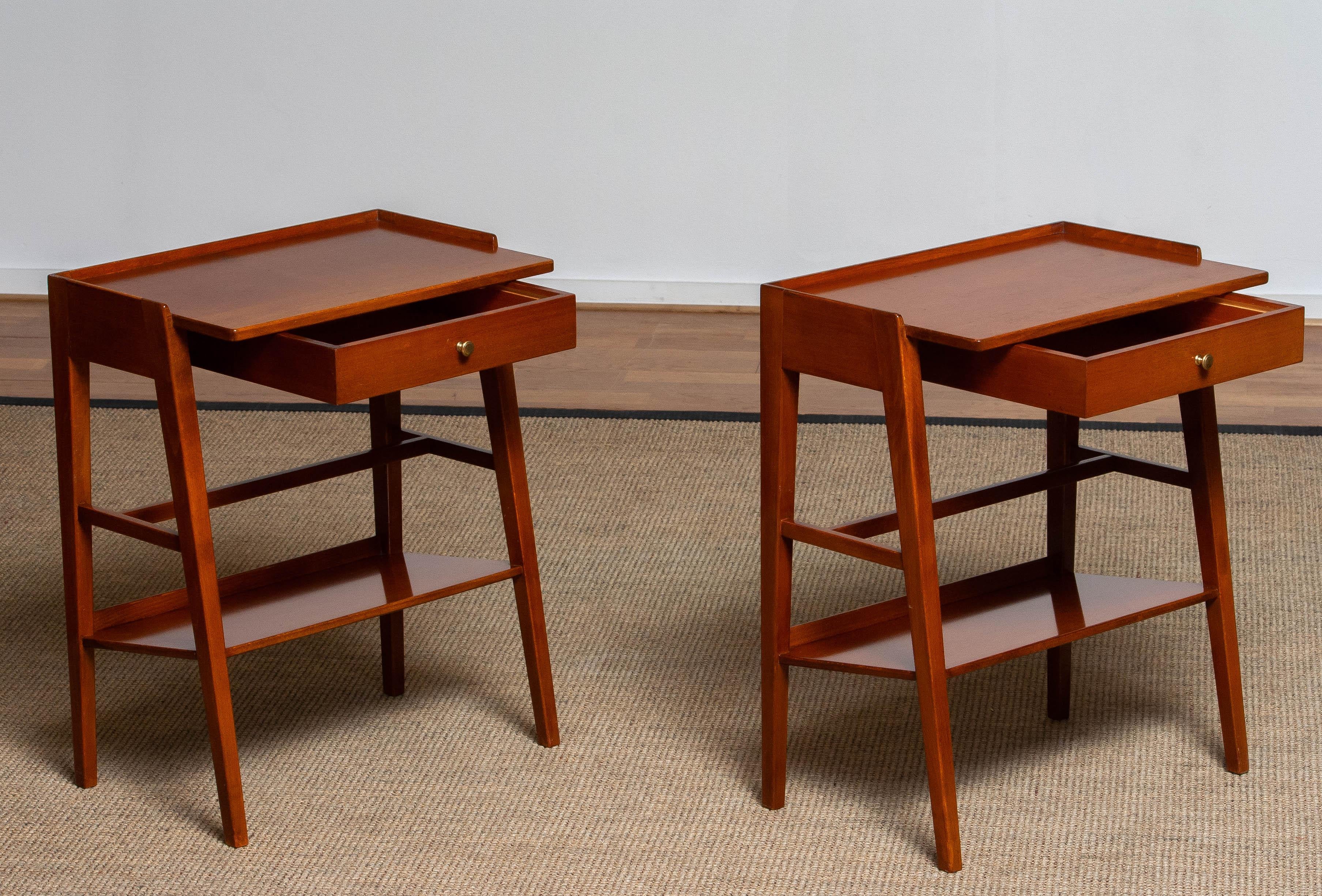 Exclusive set of two great designed and well made Swedish solid mahogany nightstands / bedside tables from the '60s.
Consists beside the great design a drawer and a bookshelf each. Overall in good condition.
Because Shipping Costs highly fluctuate