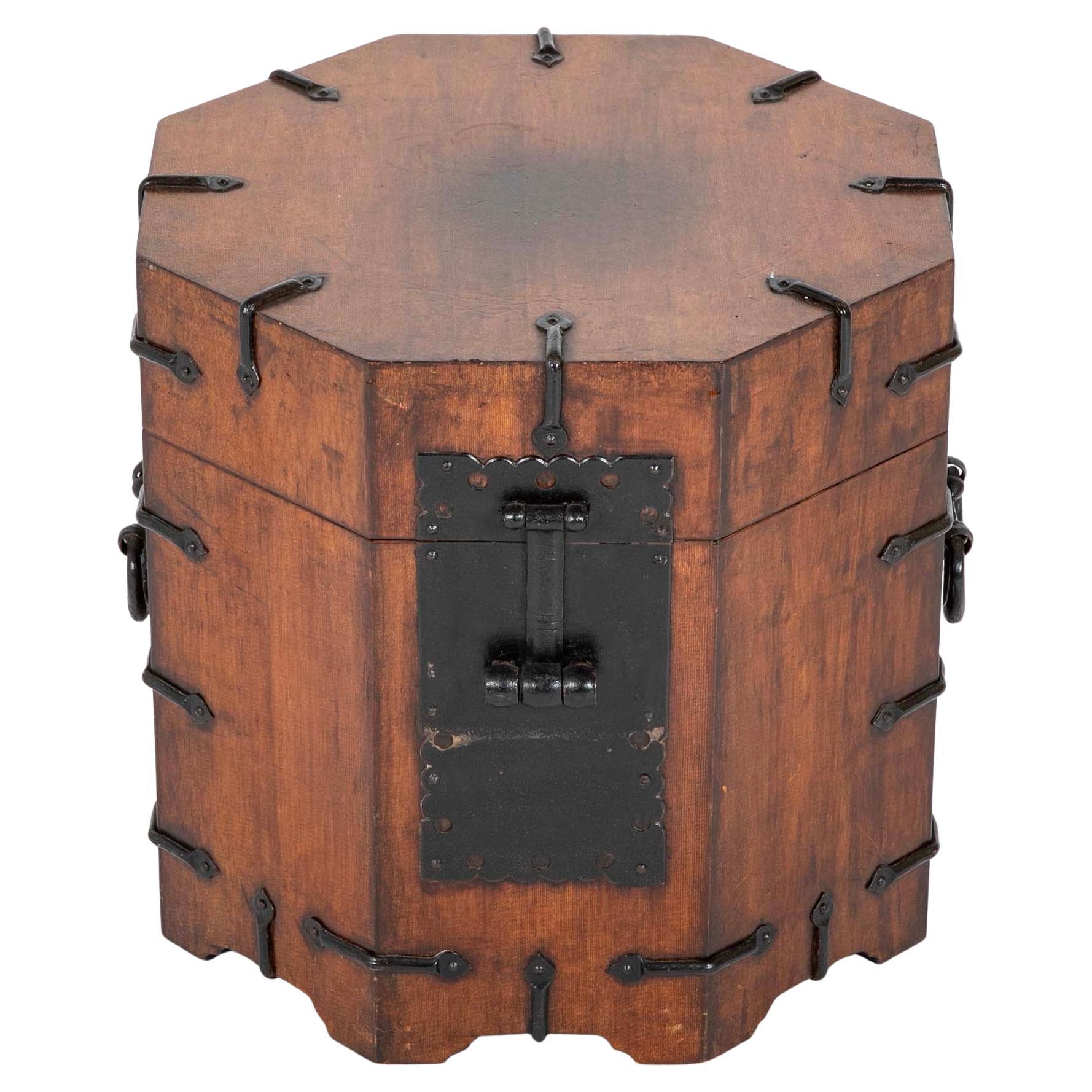 Pair of Southeast Asian octagonal hard wood side tables with wonderful black iron mounts. The tops lift up for storage. a very handsome pair of side tables that double as a place to stash dog toys, weights, newspapers, even your weed! 

15.5 inches