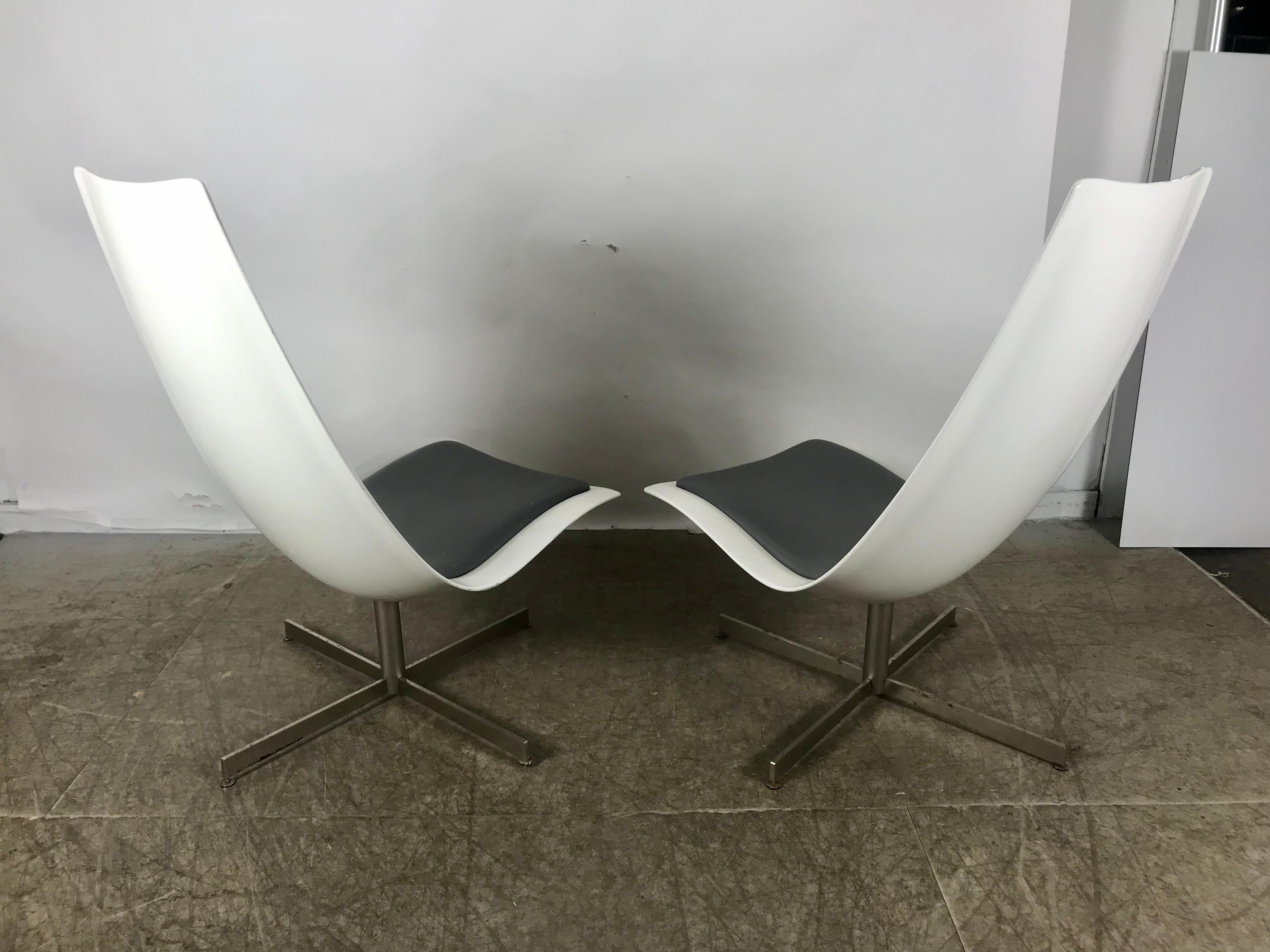 Pair of Space Age high back fiberglass swivel chairs, possible prototypes made for Expo 67 (Montreal). Exceptional quality and construction, heavy fiberglass, stainless steel bases. Retains original gun-metal grey Naugahyde back and seat pads.
