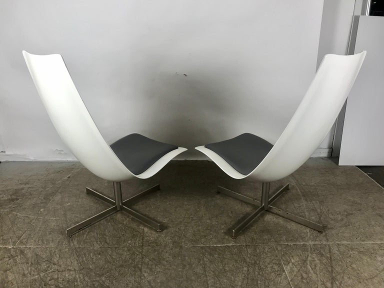 Pair of Space Age high back fiberglass swivel chairs, possible prototypes made for Expo 67 (Montreal). Exceptional quality and construction, heavy fiberglass, stainless steel bases. Retains original gun-metal grey Naugahyde back and seat pads.