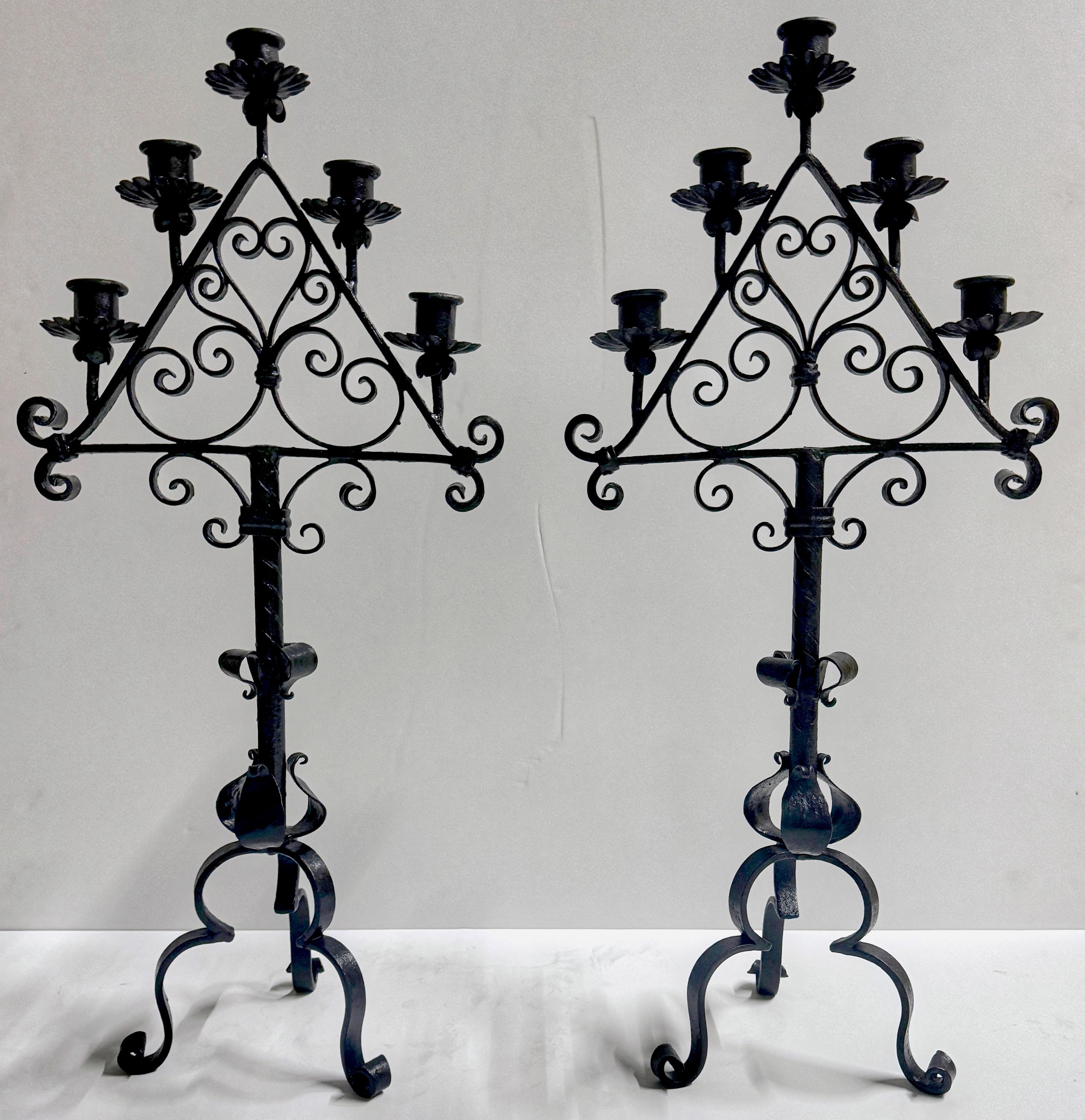 Pair Spanish Colonial Style Forged Iron Candelabra, Atrib. to Addison Mizner 
USA, Circa 1930s
Attributed to Addison Mizner (1872 -1933) 
Provenance: Palm Beach Estate

Illuminate your interior with the timeless elegance of these exquisite Spanish