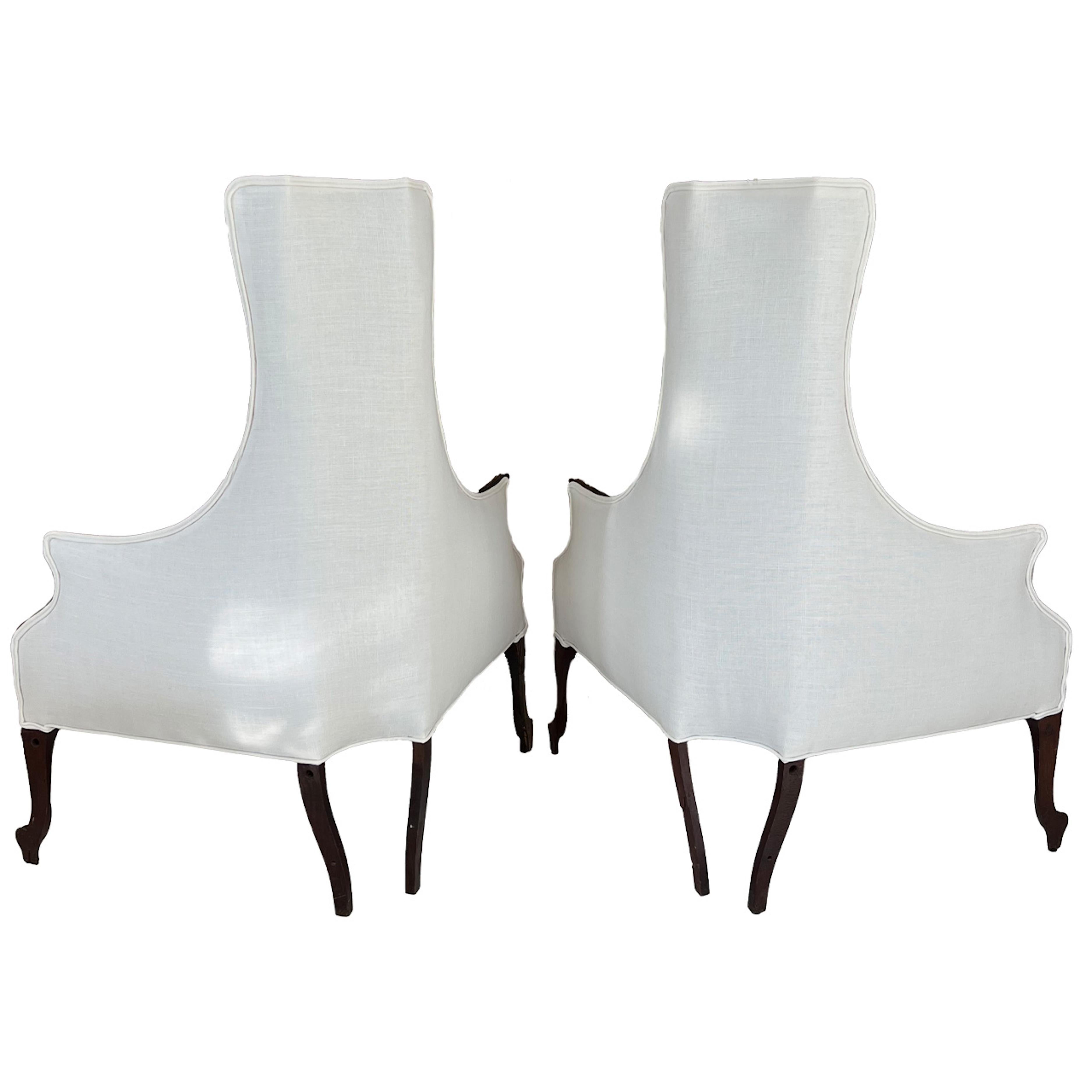 Corner chairs that demand attention. Wood with gilded accents and new white Belgian linen upholstery make these chairs a stand out.