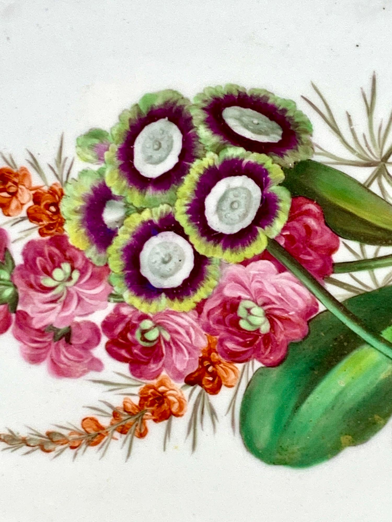 These dishes were hand painted at Spode in England around 1820.
During the late 18th and early 19th century, flower painting was a popular style for decorating English porcelain.
One possible reason for this trend is that porcelain, like a flower,