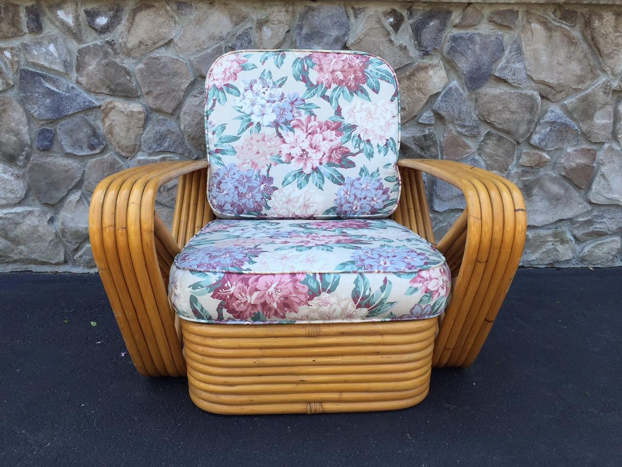 Pair of square pretzel rattan lounge chairs in the style of Paul Frankl. The chairs have a stacked rattan base with original cushions.
Measures: 31 W x 37.5 D x 31 H (to top of back cushion).