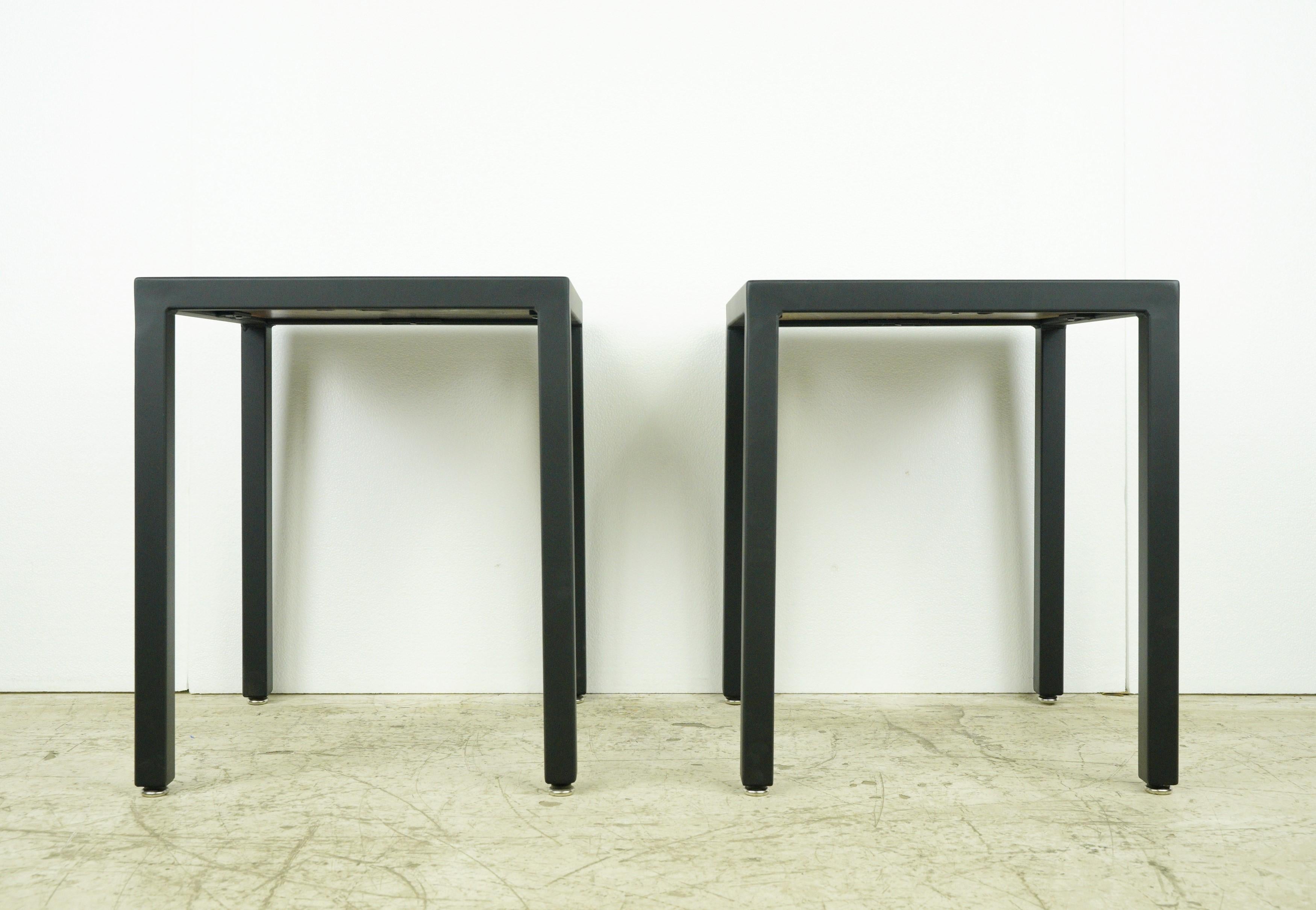 Meticulously crafted, these side tables feature newly constructed black steel frames paired with square  walnut table tops. The combination of steel and walnut creates a stylish and durable design, making these end tables perfect for a variety of