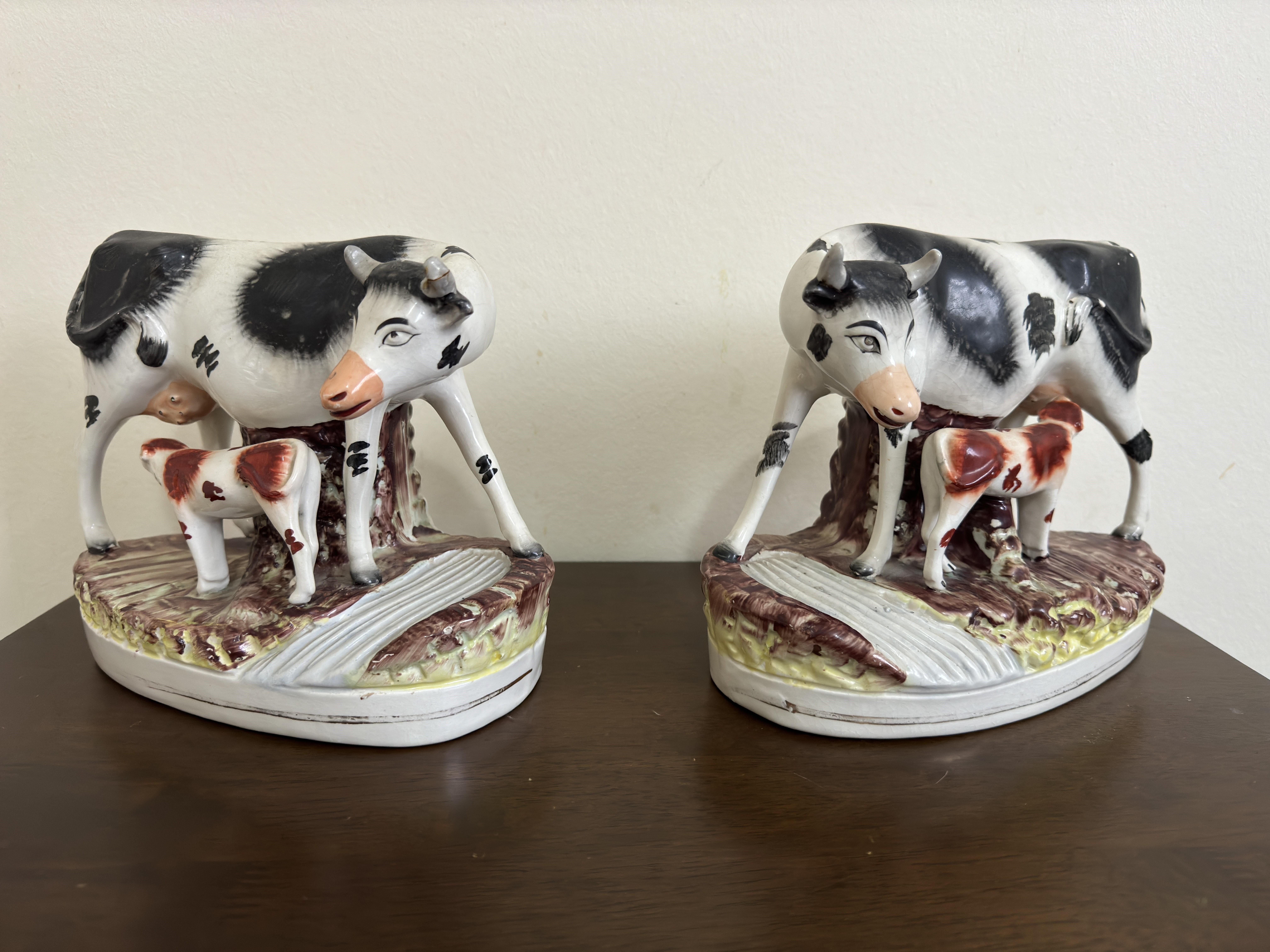 A rare pair of 19th Century Staffordshire cows with their feeding calves, nicely coloured ceramic enamels, made circa 1880.

24 cm (9 inches) long, 20 cm (7.5 inches) high, 12 cm (4.5 inches) depth