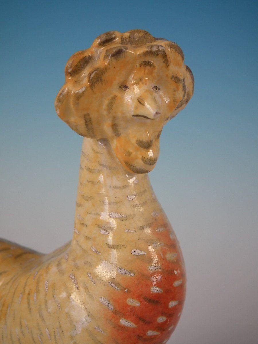 Poterie Paire de figurines Staffordshire représentant une poule et un coq / coq en vente