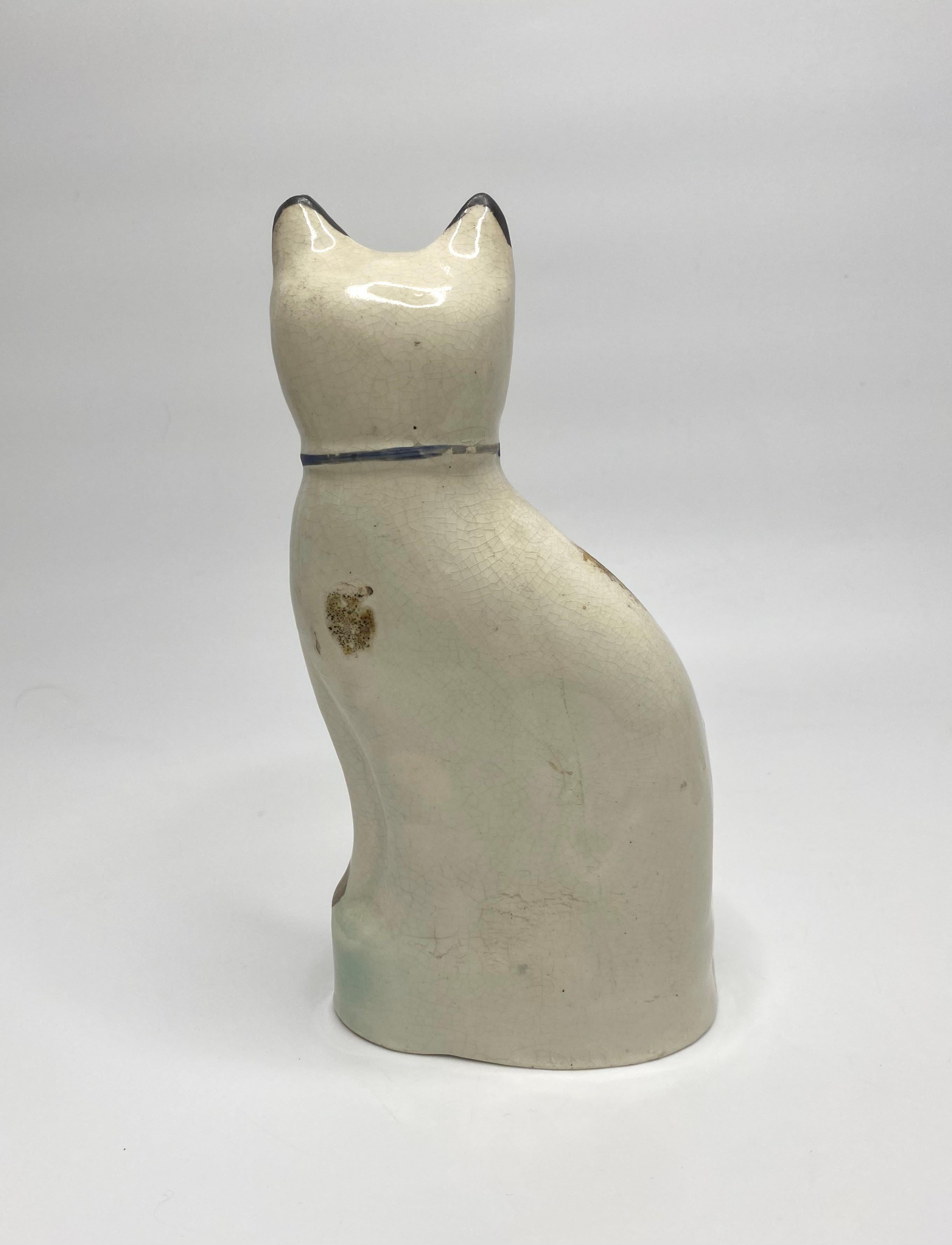 English Pair Staffordshire pottery seated cats, c. 1860.