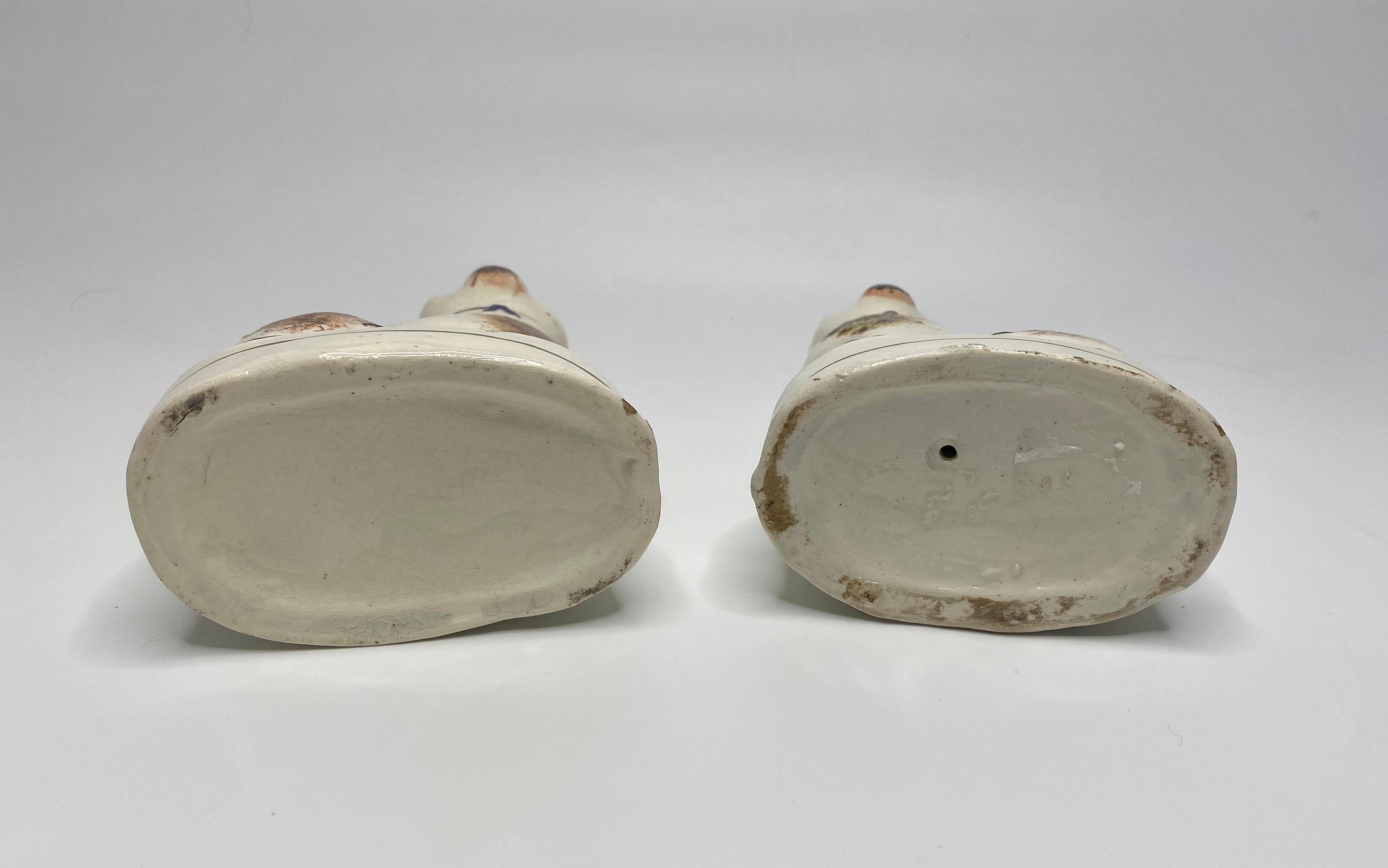 Fired Pair Staffordshire pottery seated cats, c. 1860.