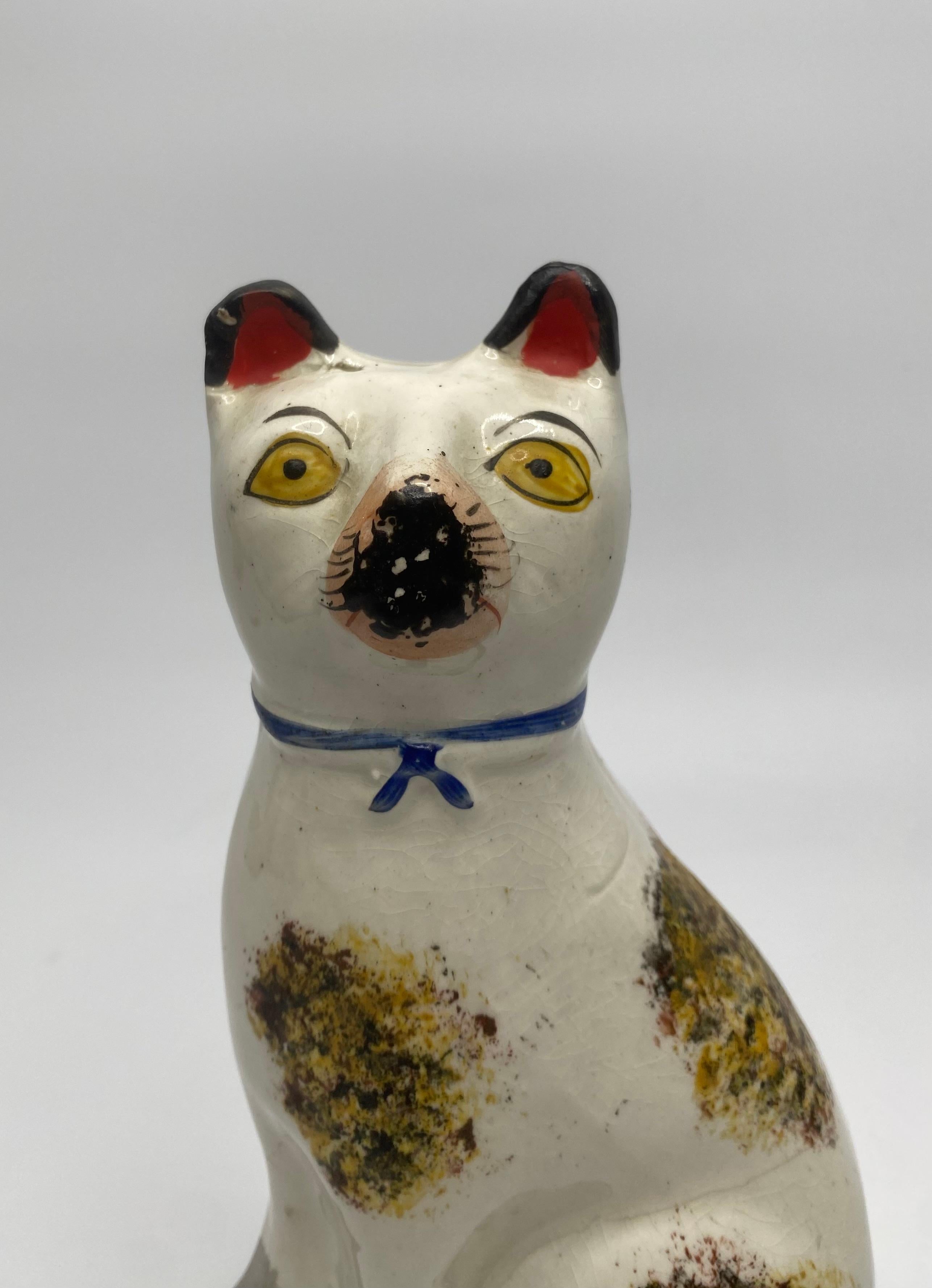 Mid-19th Century Pair Staffordshire pottery seated cats, c. 1860.
