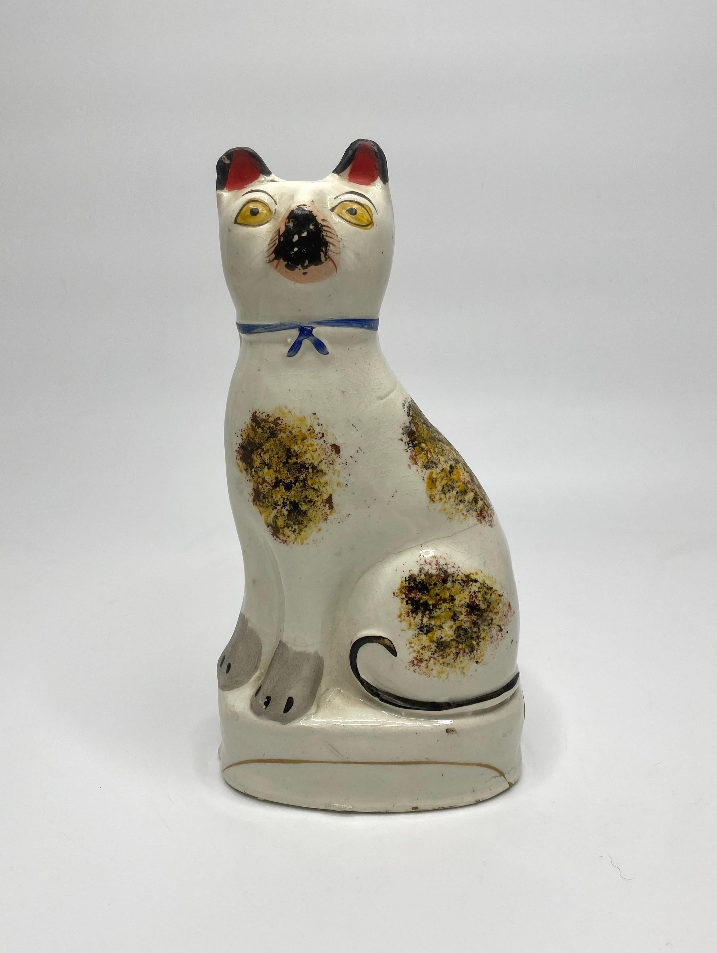 Pottery Pair Staffordshire pottery seated cats, c. 1860.