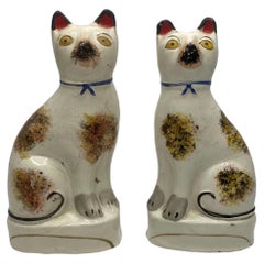 Pair Staffordshire pottery seated cats, c. 1860.