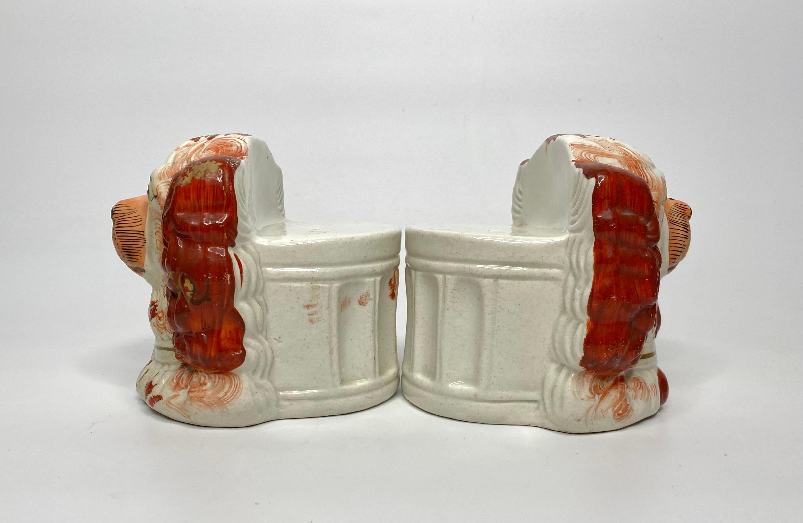 A rare pair of Staffordshire pottery sash window rests, c. 1850. Modellers the heads of Spaniels, painted liver red spots, having yellow eyes, and wearing gilt lockets and collars.
The rears with ‘D’ section, moulded with arches, to rest your window