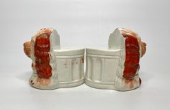 Pair Staffordshire pottery Spaniel window rests, c. 1850.