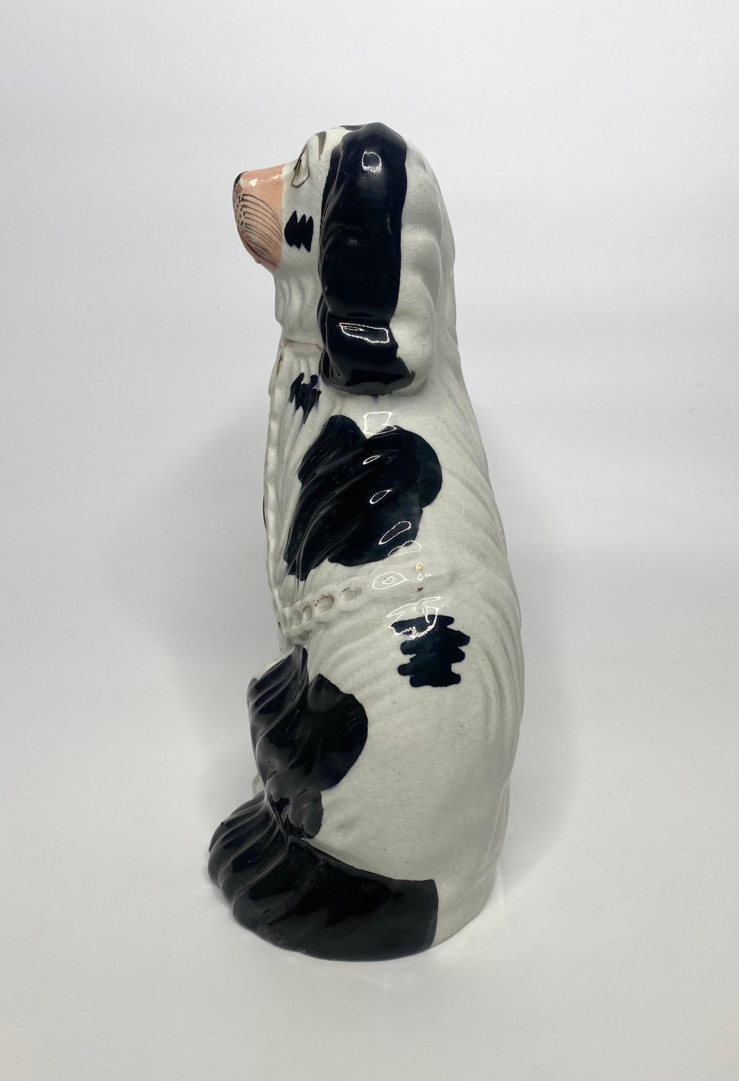 Mid-19th Century Pair Staffordshire pottery Spaniels, c. 1850.