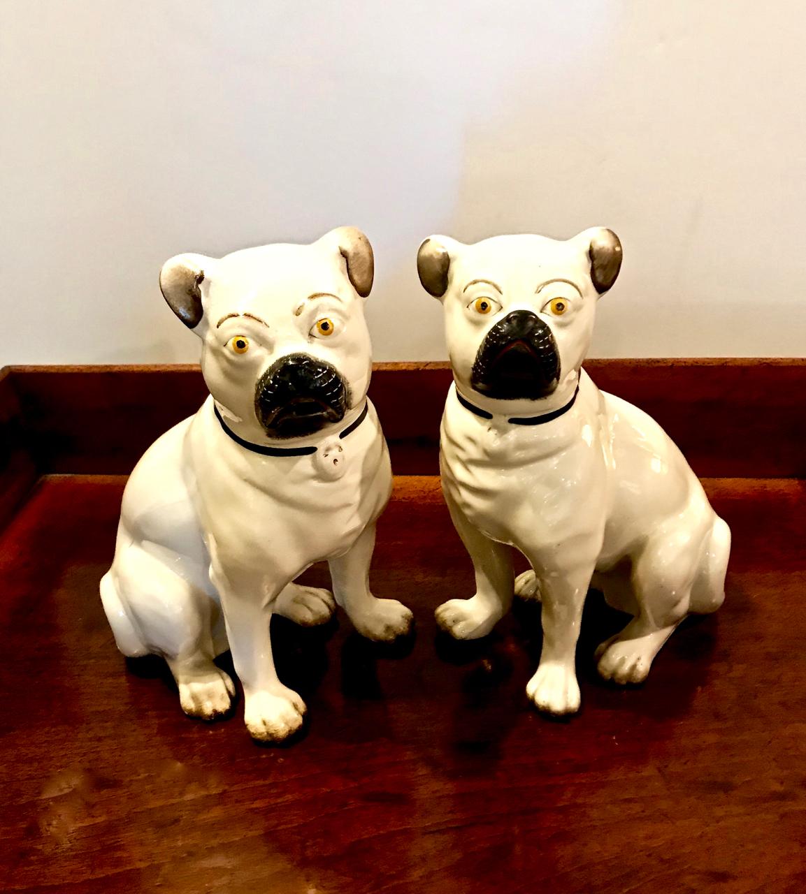 This is a wonderful pair of late 19th century Staffordshire pugs. The guys show a lot of character and attitude.