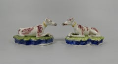 Pair Staffordshire recumbent hounds. Enoch Wood, c. 1830.