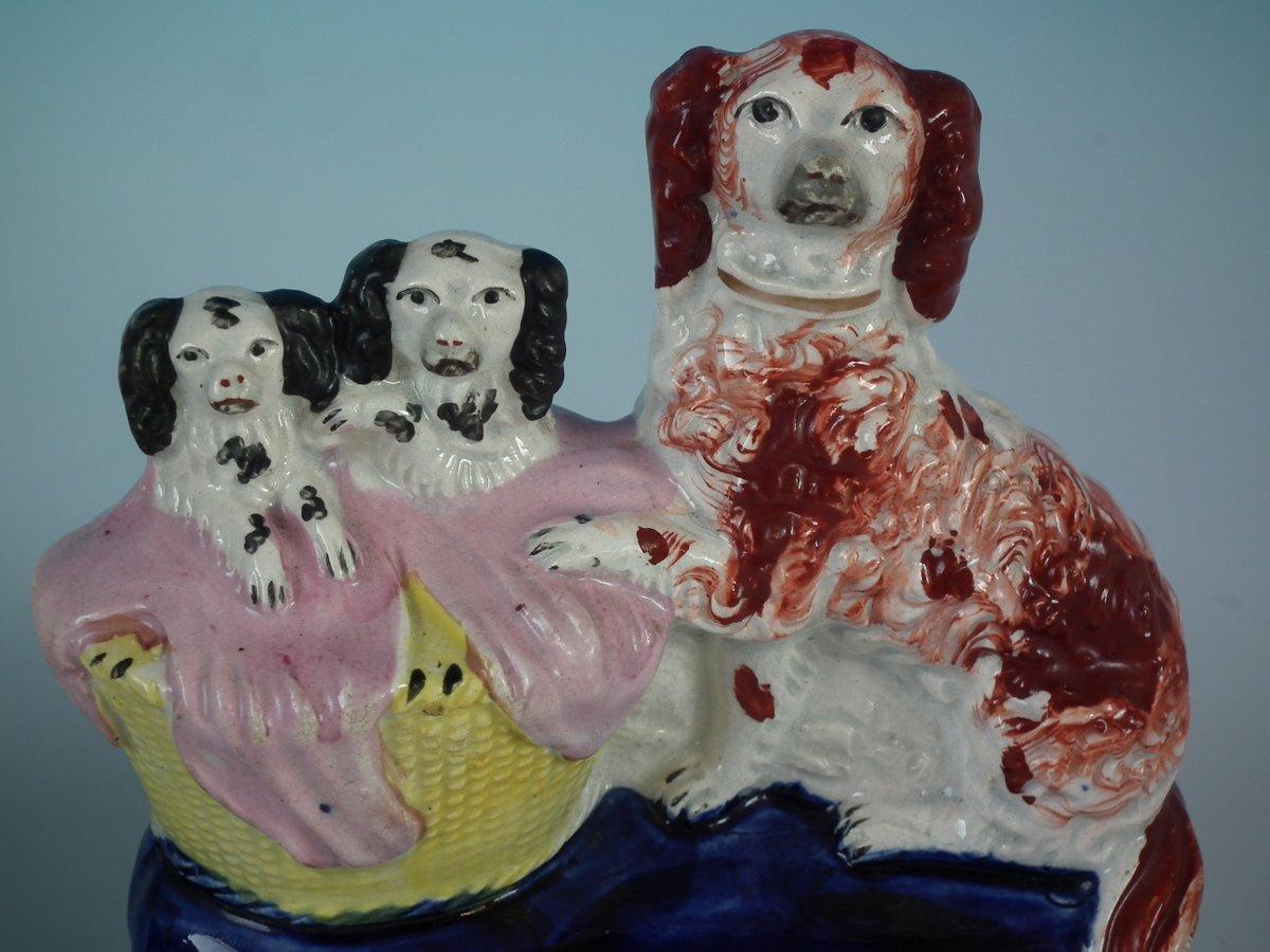 Mid-19th Century Pair of Staffordshire Spaniel and Pups in Wash Basket