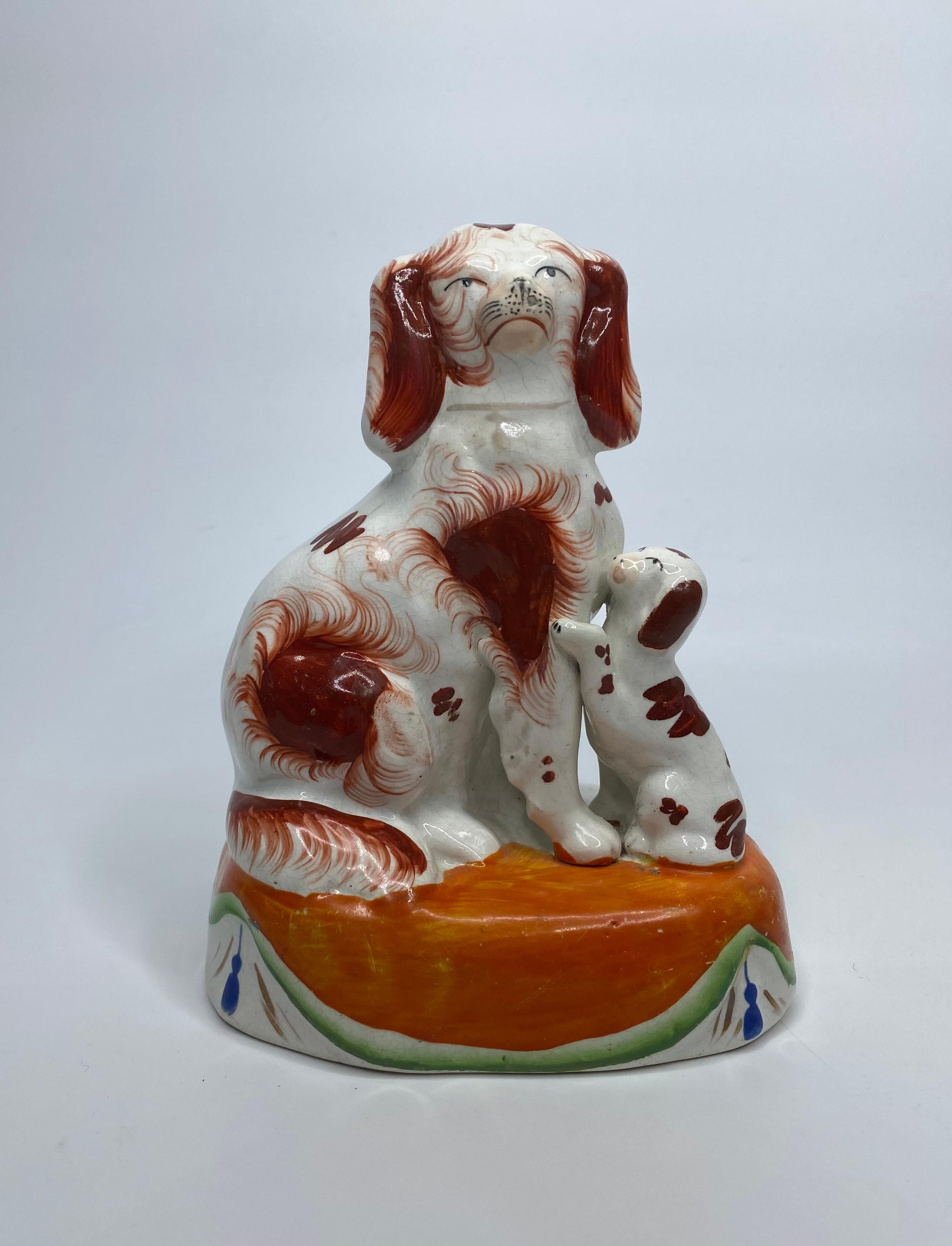 Victorian Pair Staffordshire Spaniels with puppies, c. 1850.
