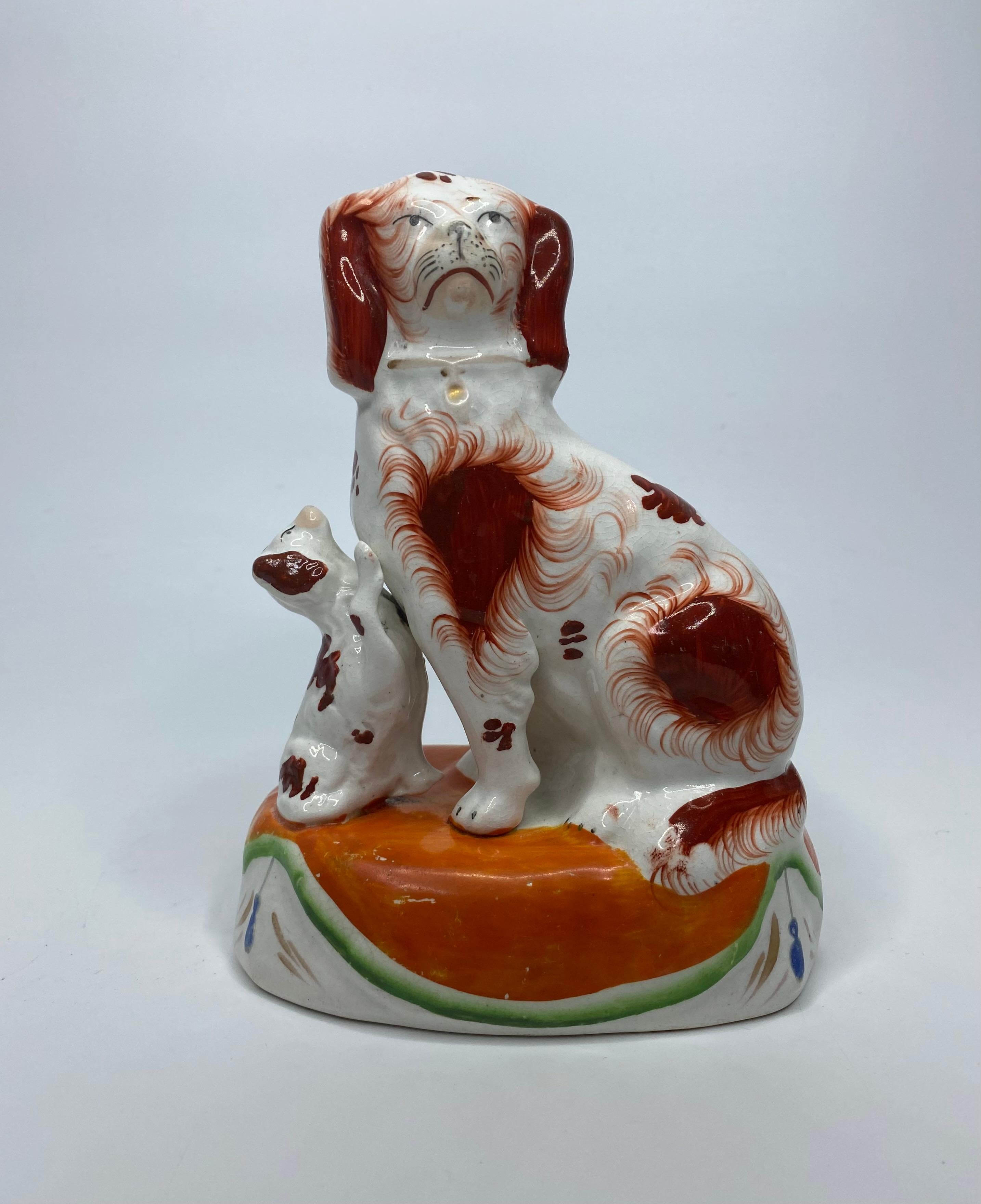 English Pair Staffordshire Spaniels with puppies, c. 1850.