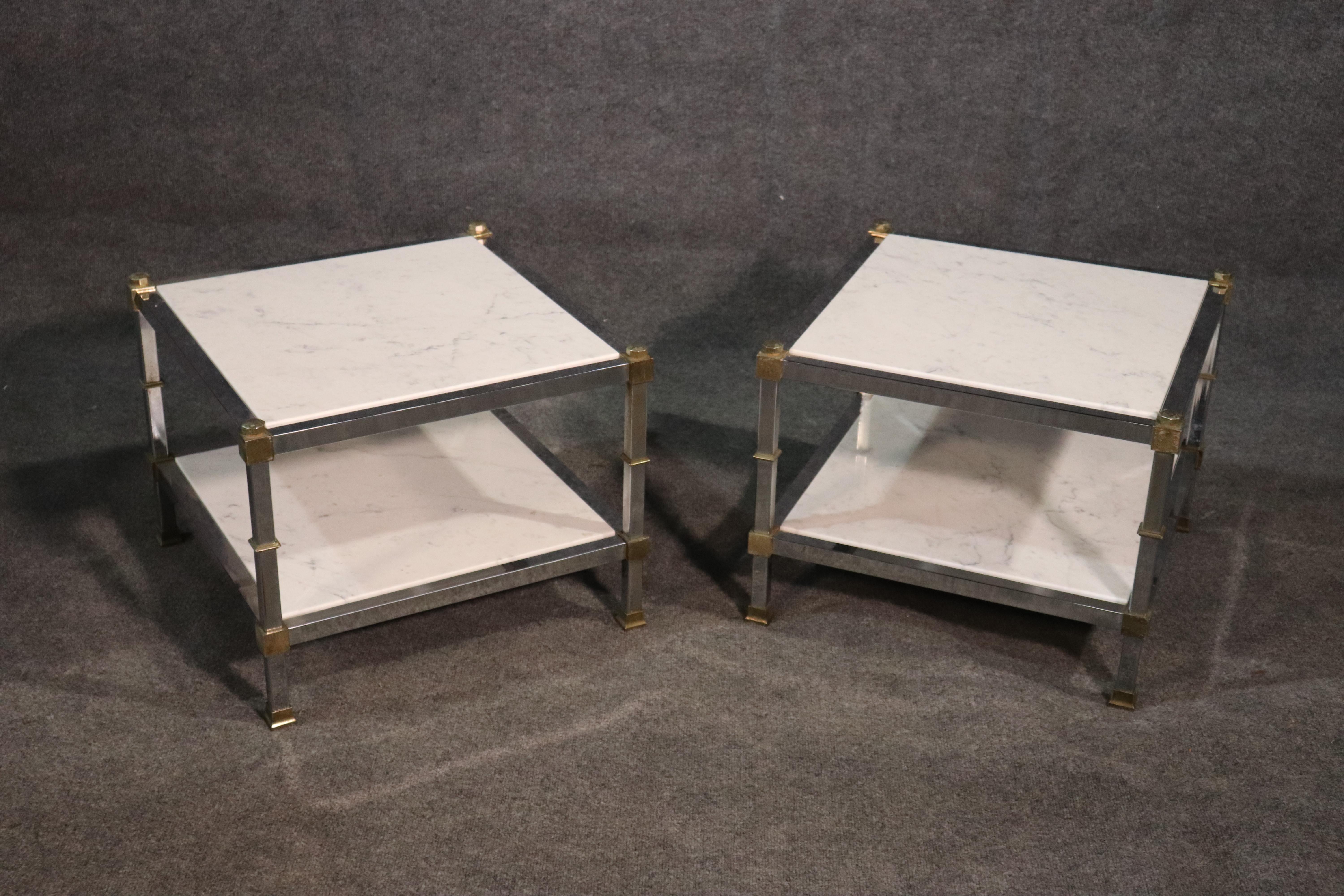 This is a pair of end tables with white marble tops and bottoms and brass and steel frames. designed in the manner of Maison Jansen, these end tables are perfect for a low Mid-Century Modern sofa. They date to the 1960s era.
Measures: 16.5 inches