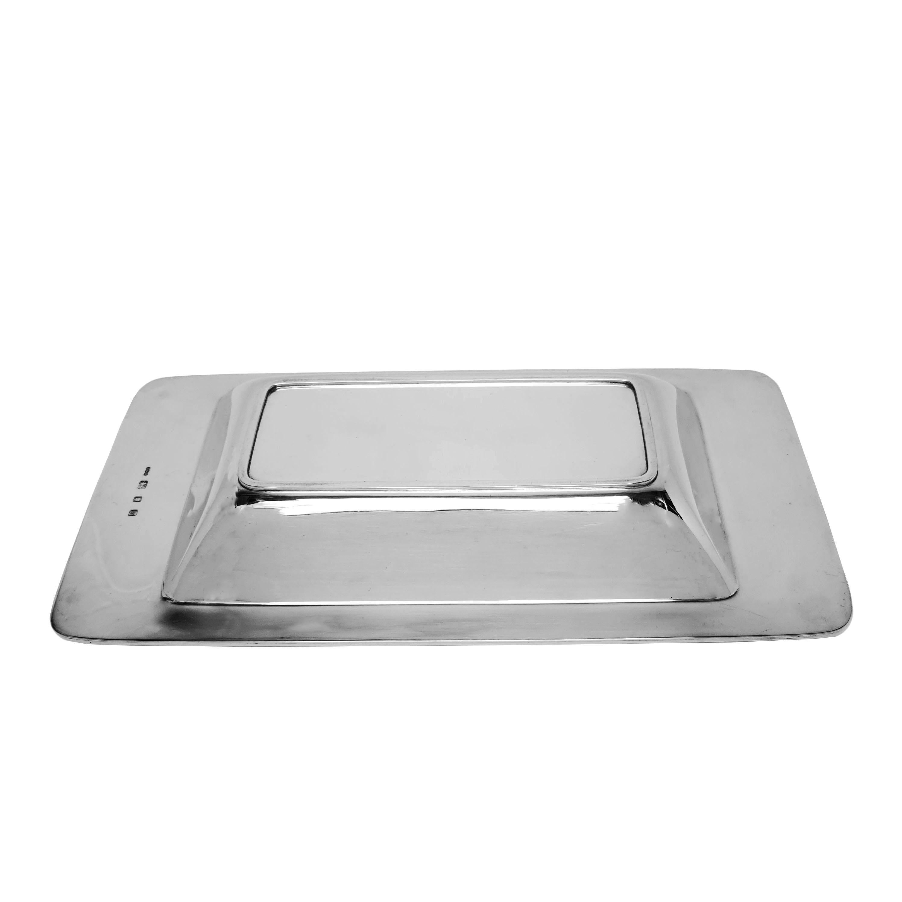 A pair of magnificent Gerald Benney Entree Dishes with an elegant, understated rectangular design. The fitted lid can be inverted for use as a serving dish if desired. These Silver Vegetable Serving Dishes have a modern design and a highly polished