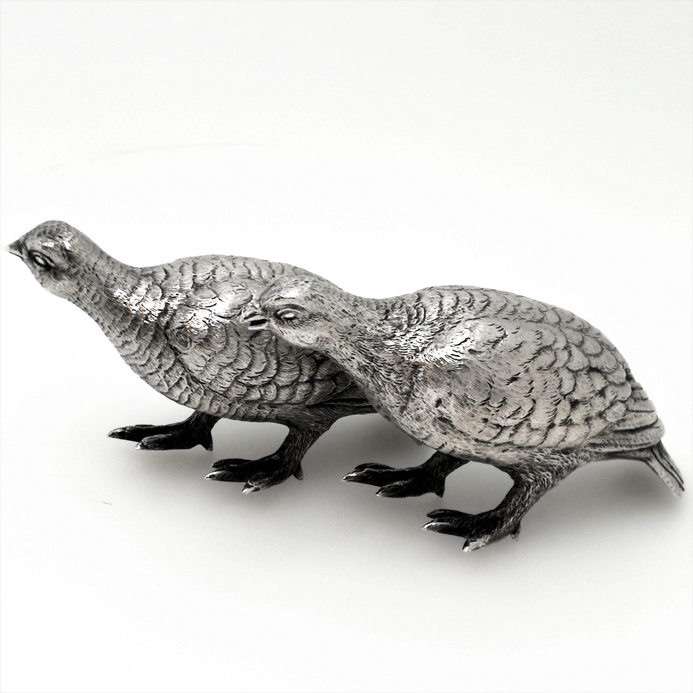An elegant pair of solid silver models in the shape of grouse birds. These figures are modelled with a lovely attention to detail and are of notably good weight.

Made in London in 1964 by N. Leslie.
 
Approx. total weight 412g / 13.2g
Approx.