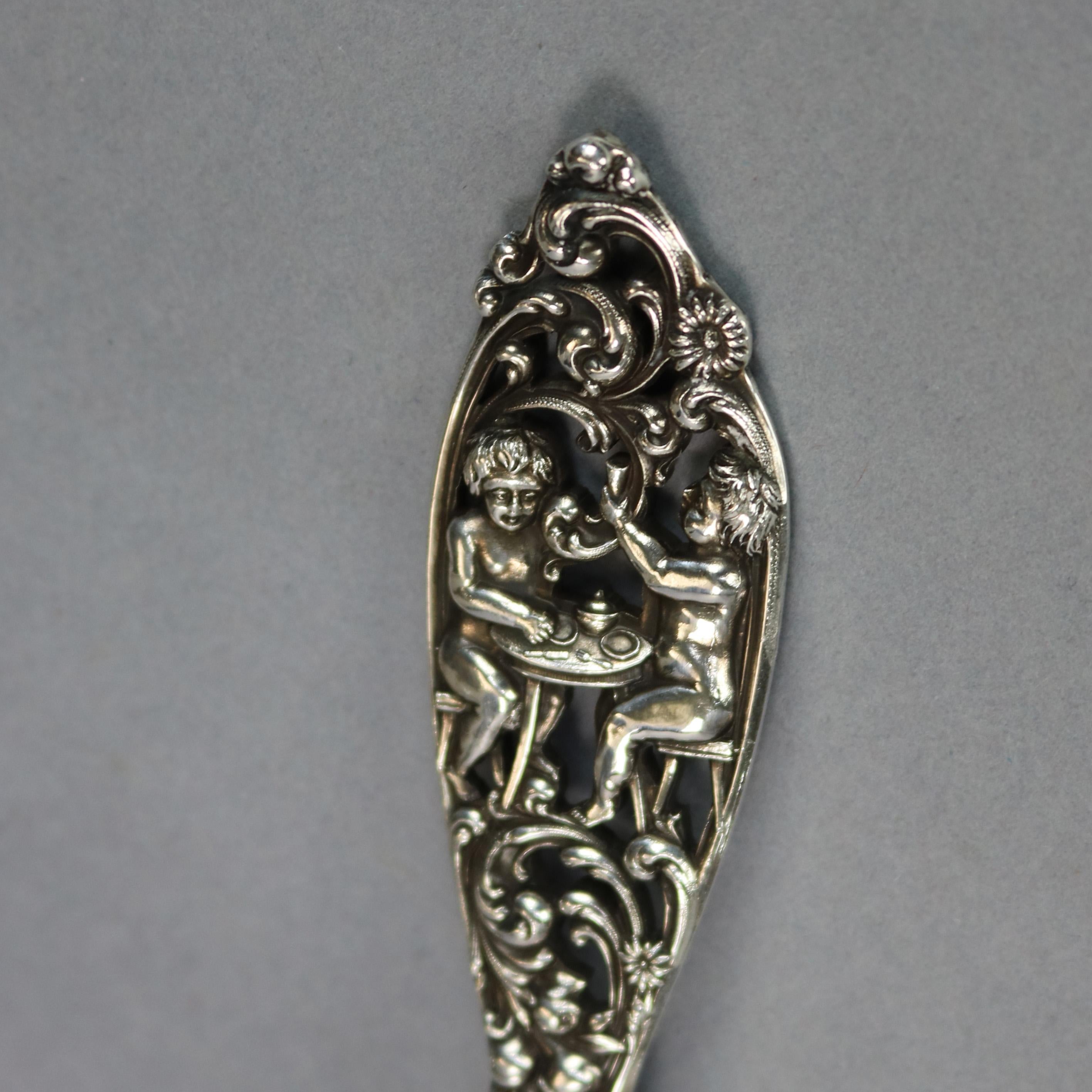 An antique pair of sterling silver figural 