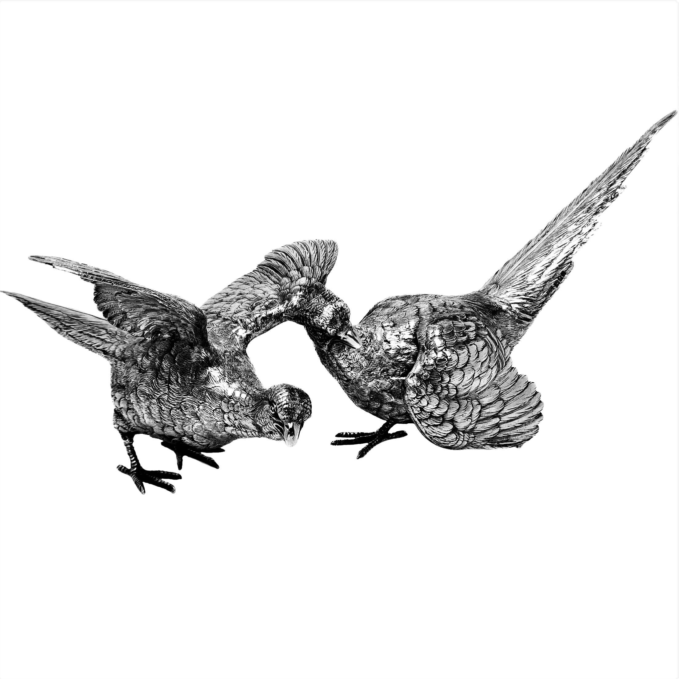 A pair of classic Sterling Silver Pheasants of heavy weight and made with an excellent attention to detail. The Pair of Birds consists of one cock Pheasant and one hen Pheasant.

Made in London in 1976 by Mappin & Webb.

Approx. Weight - 1786g /