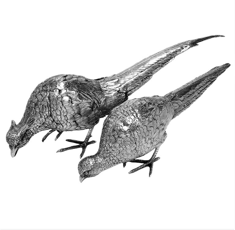 A beautiful pair of vintage solid Silver model Pheasants made in Germany and hallmarked in England. The pair of Birds comprises of one Cock Pheasant and one Hen Pheasant. Each is made with a lovely attention to detail. These classic Pheasant