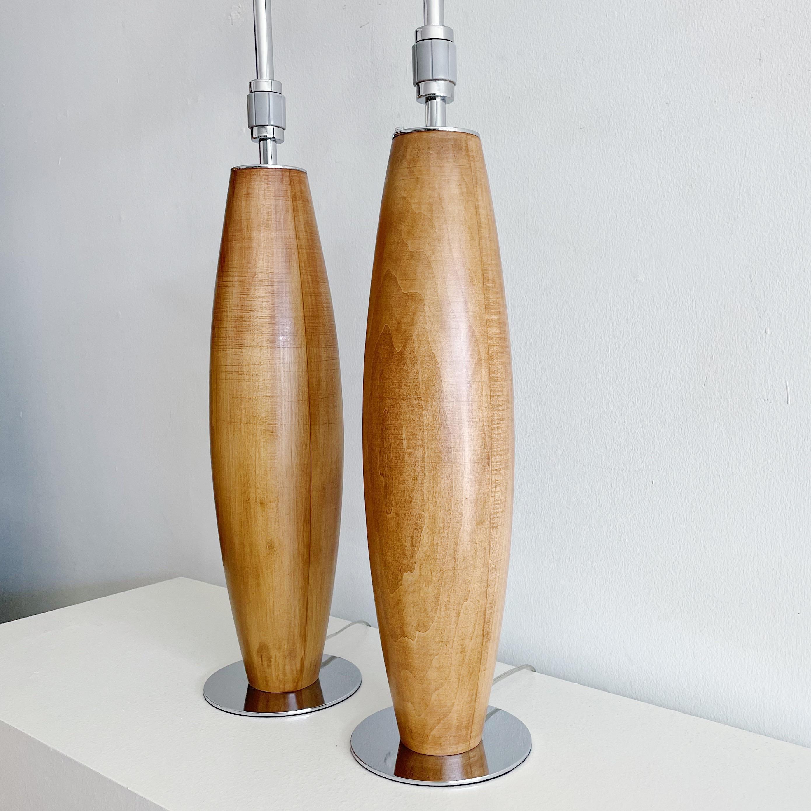 Pair of Stewart Ross James hand turned walnut lamps on chrome bases for Hansen of New York. Fully restored and ready to use. Original signature 3 way rotating switch to lamp rod.
Actual diameter of Wood is 4.5