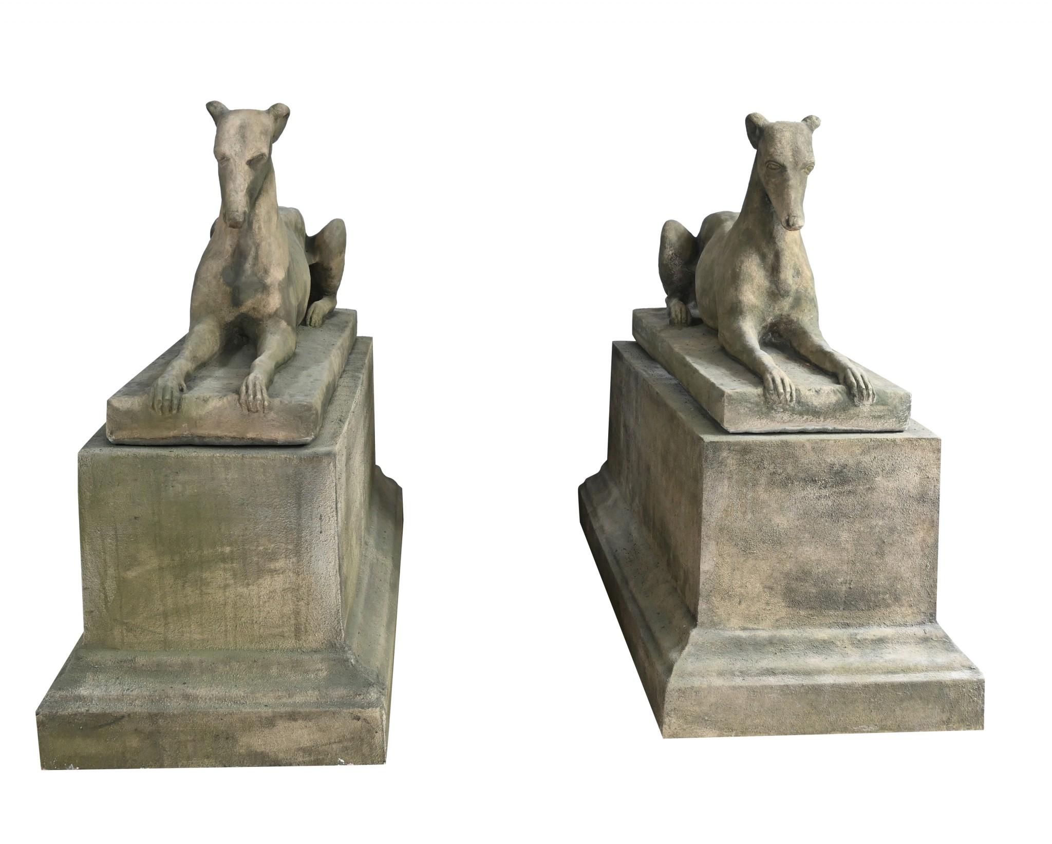 You are viewing a classic pair of stone garden dogs on oblong pedestal stands
Great pair to place in the garden either side of a door or entrance
Made in the manner of the famous Austin and Seeley greyhound
Crafted from reconstituted stone with