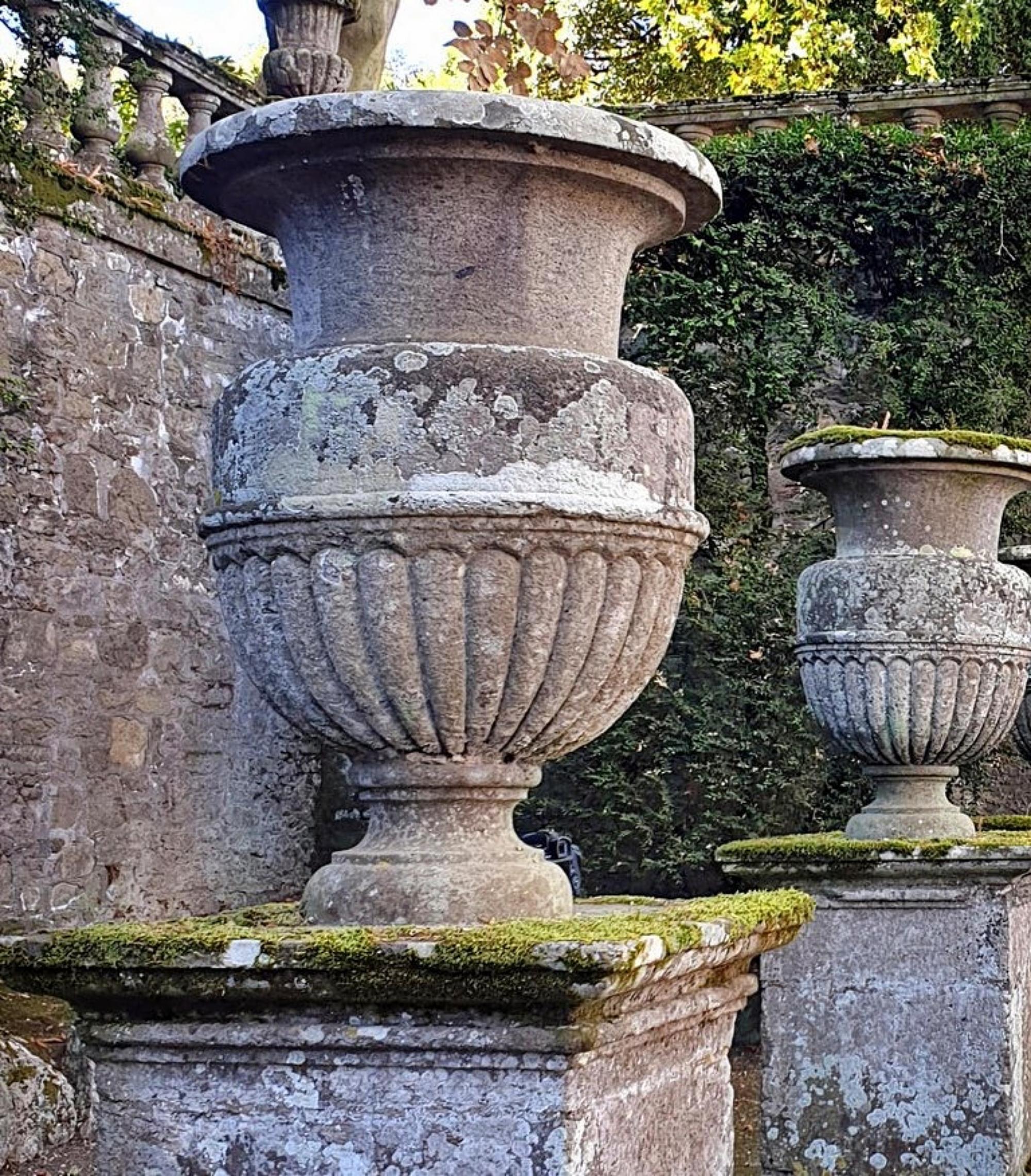 Pair stone vases of Villa Lante Della Rovere early 20th century
Italy
The Villa has one of the most beautiful Renaissance parks in Italy. 
Vase with 26 vertical pods.

Height 71 cm
Diameter 50 cm
Weight 160 Kg
Where the original Villa Lante