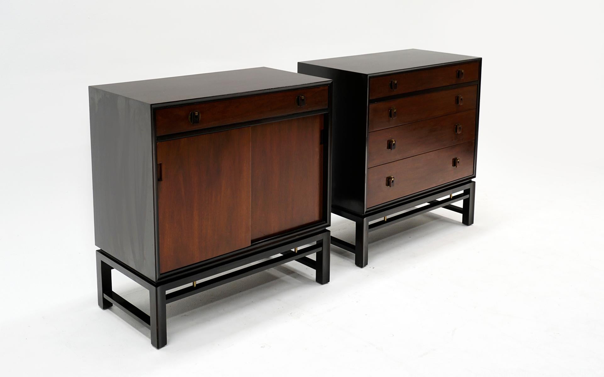 Pair of cabinets designed by Edward Wormley for Dunbar, 1950s. Dark mahogany frames with brass detail. Faces are a.lighter stained mahogany with rosewood pulls. One owner, original and show some wear in the form of scratches, dents, but can be used